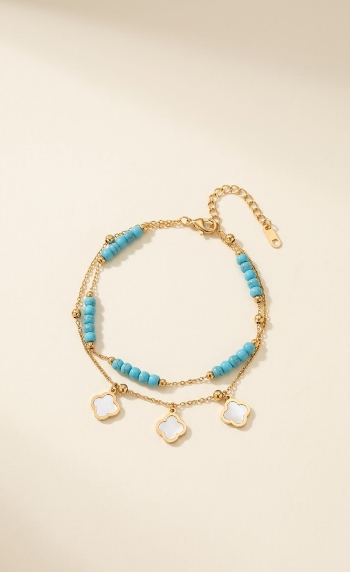 Gold-tone layered anklet with turquoise beads and white quatrefoil charms - view 2