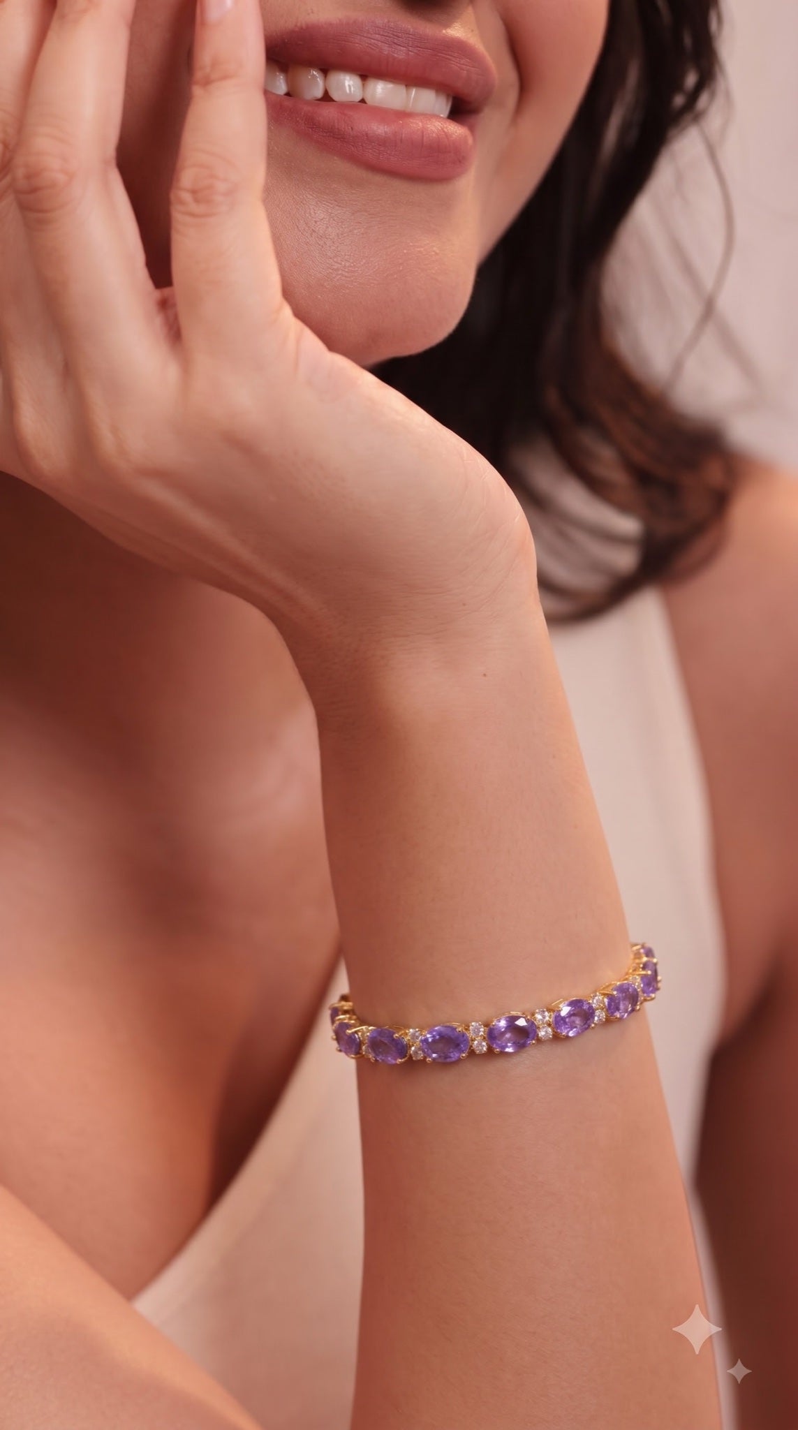 Gold-tone tennis bracelet with lavender oval stones