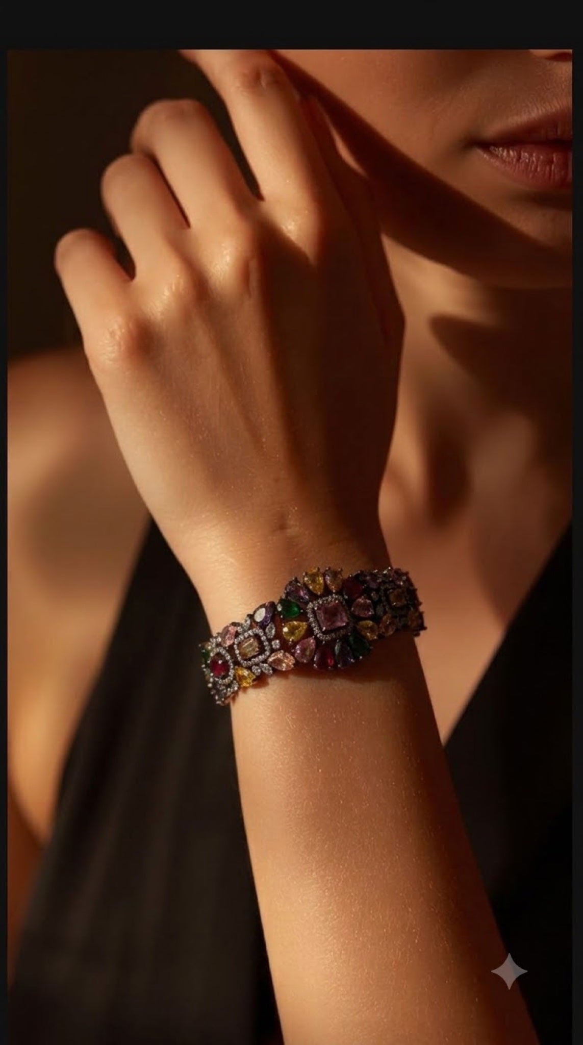 Gunmetal statement bracelet with multicoloured stones