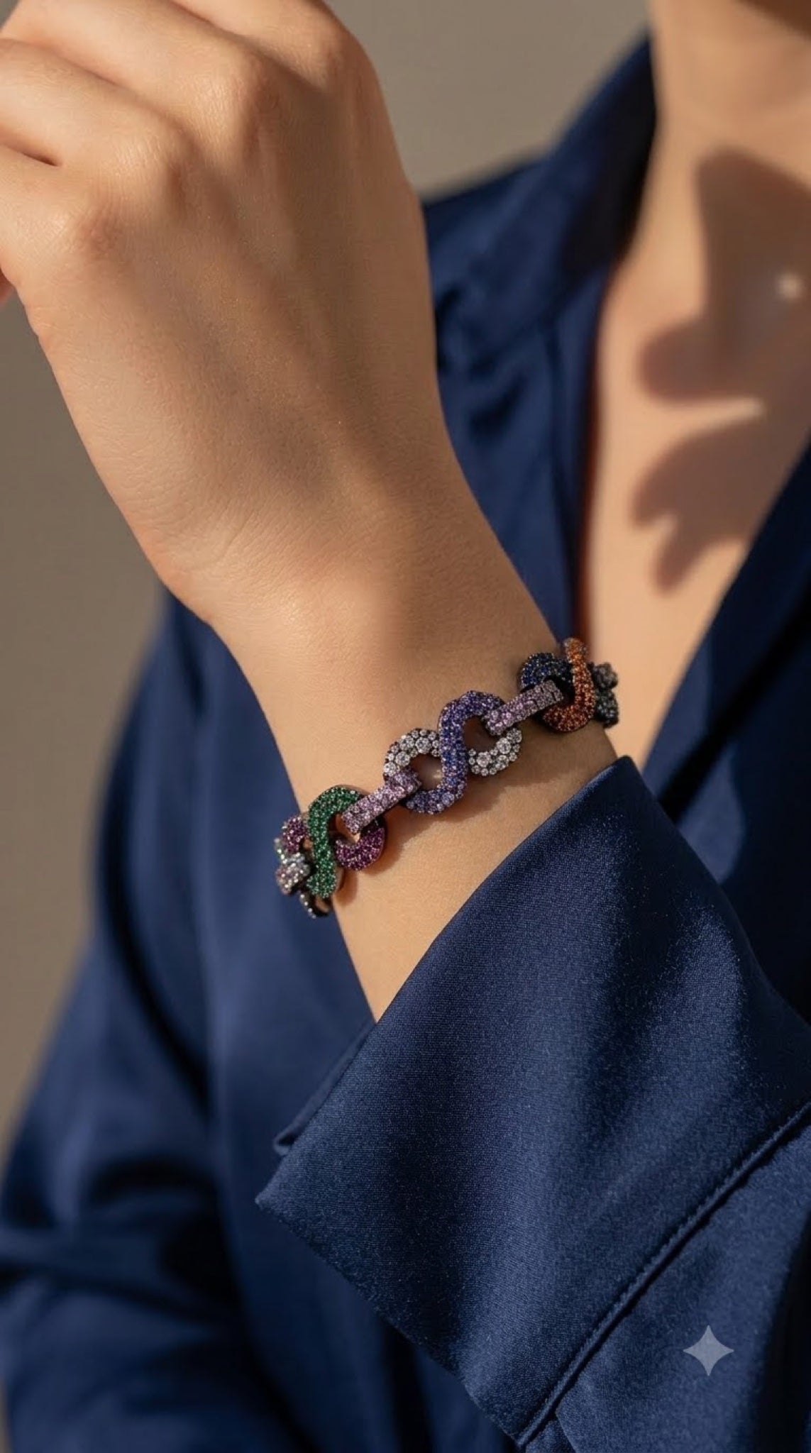 Gunmetal link bracelet paved in multicoloured crystals