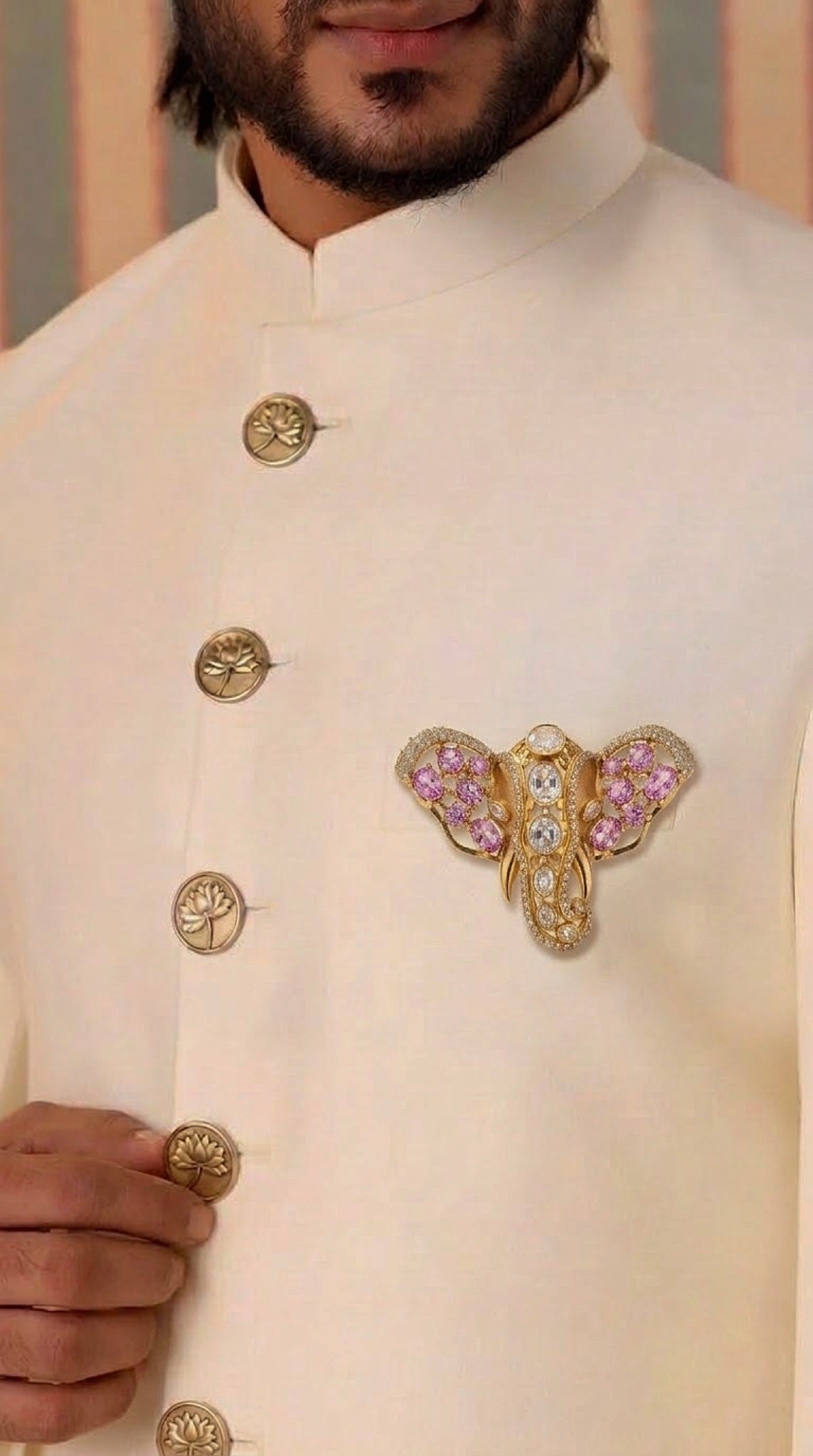 Gold-tone elephant head brooch with pink stones and polki-look centre