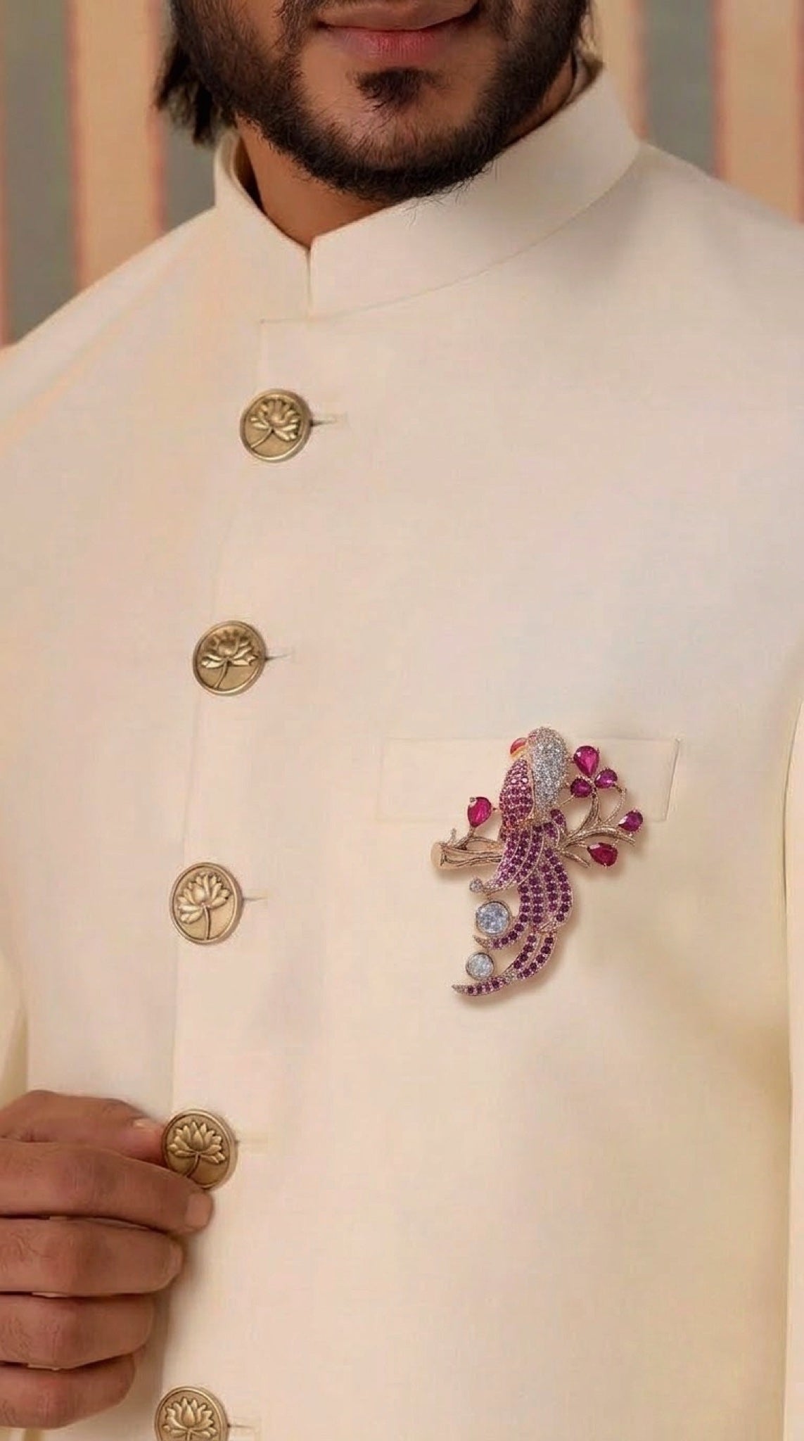 Rose gold-tone parrot brooch with ruby-pink stones and crystals