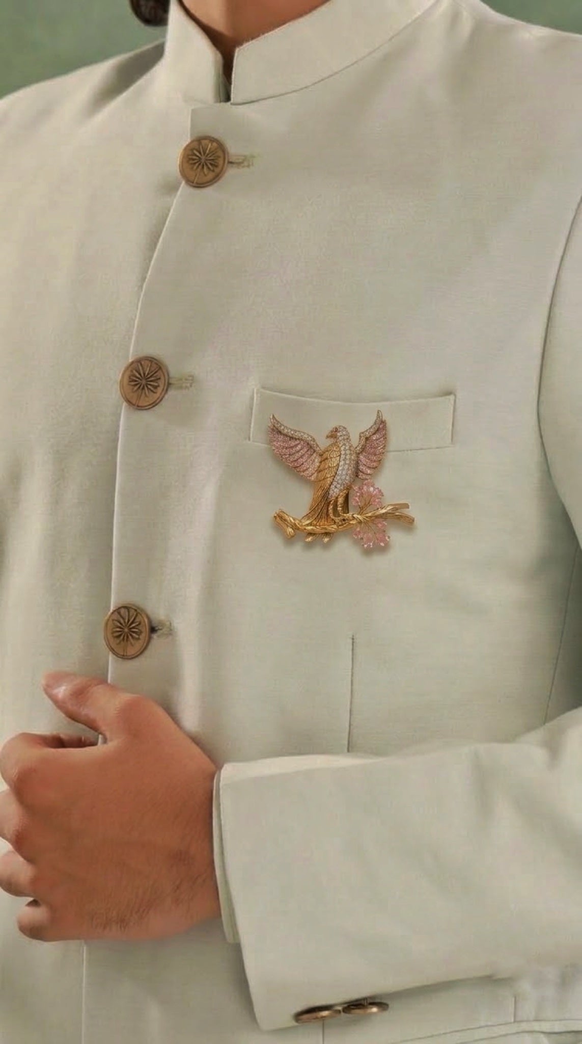 Gold-tone eagle brooch with pink crystal wings and pink teardrop stones