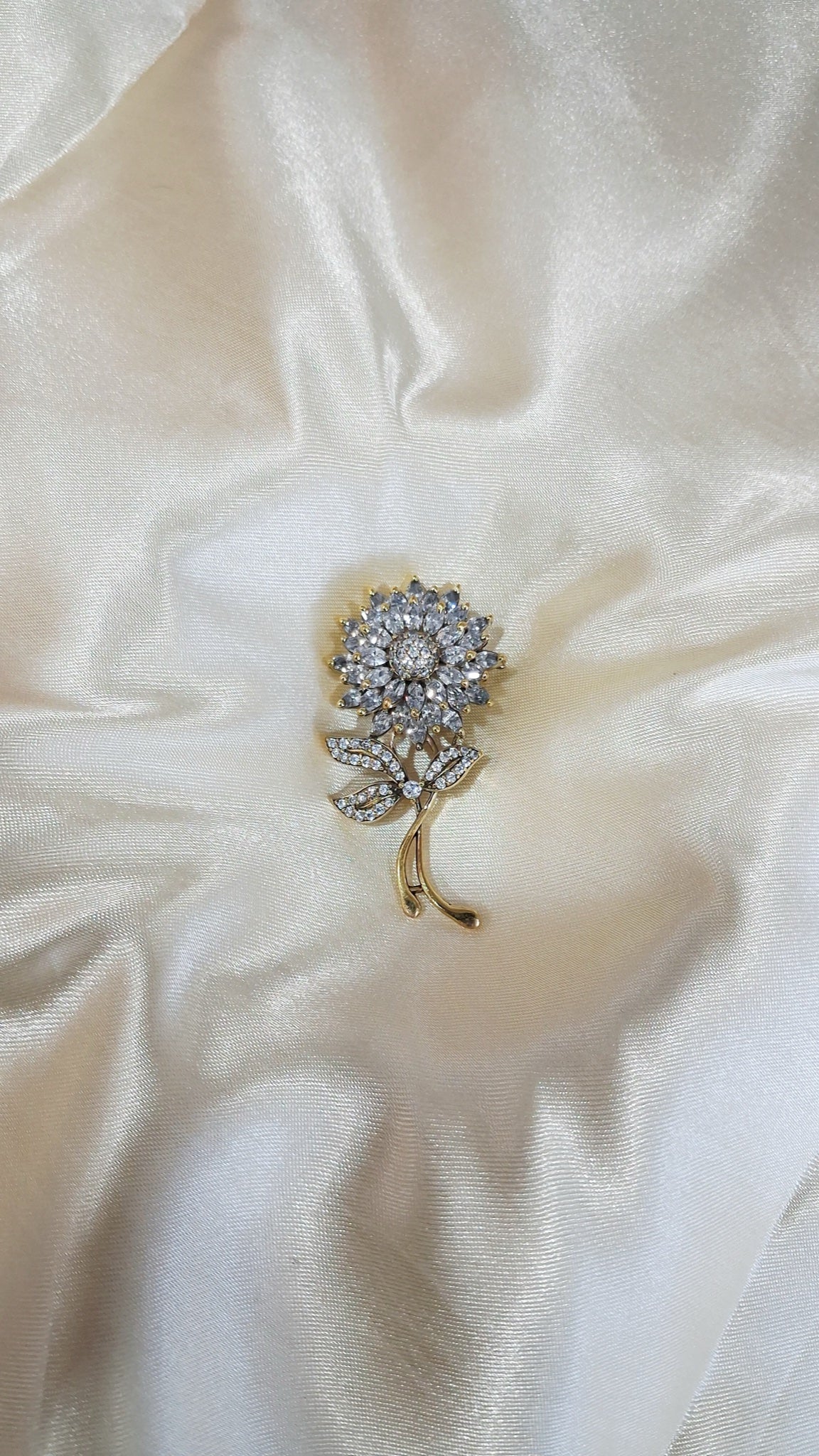 Silver-tone sunflower stem brooch with clear crystals