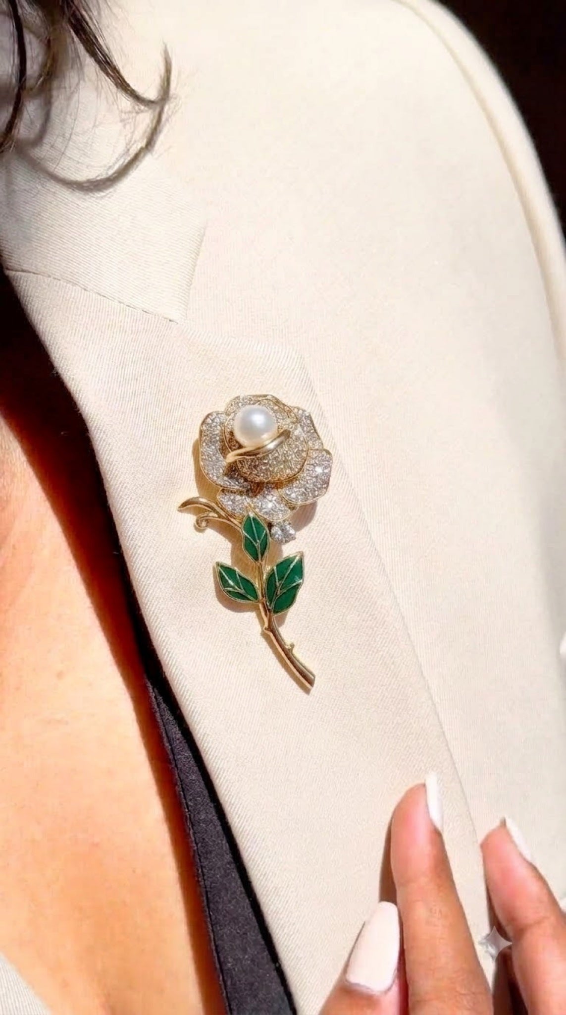 Gold-tone rose brooch with faux pearl centre and green enamel leaves
