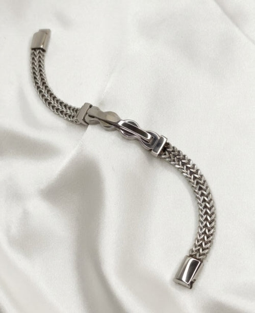 Silver-tone woven wheat chain bracelet with buckle link centrepiece