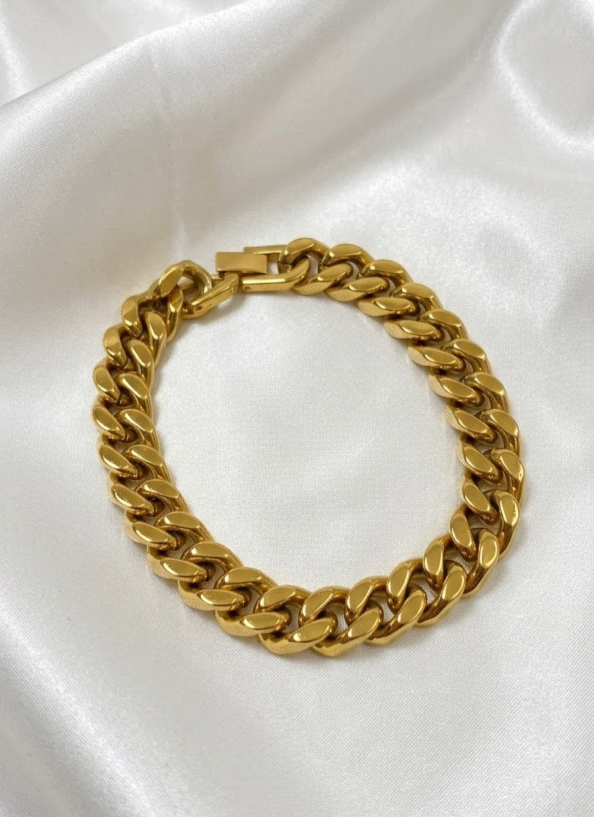 Classic curb fold-over bracelet in gold-tone and antiqued silver-tone on white satin - view 2