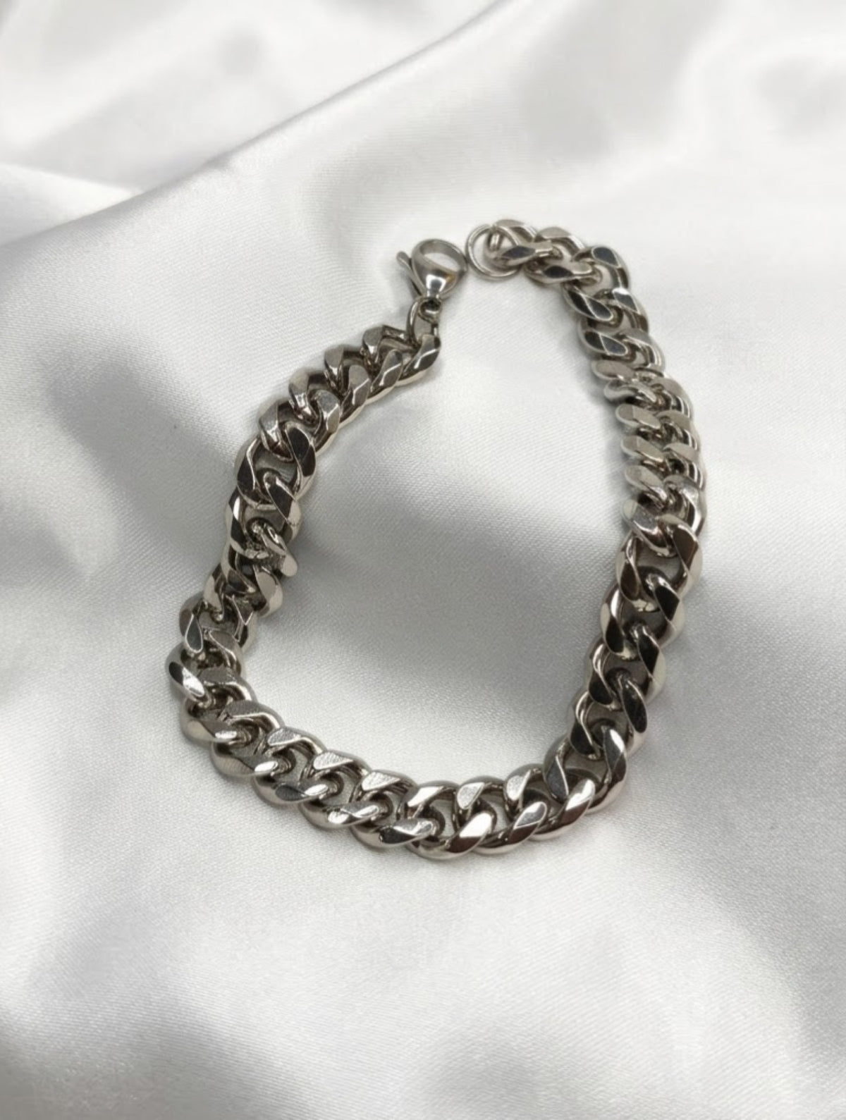 Everyday curb link bracelet in gold-tone and silver-tone on white satin - view 3
