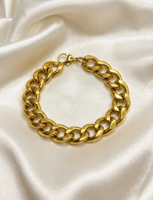 Chunky high-polish Cuban curb link bracelet with lobster clasp on white satin - view 2