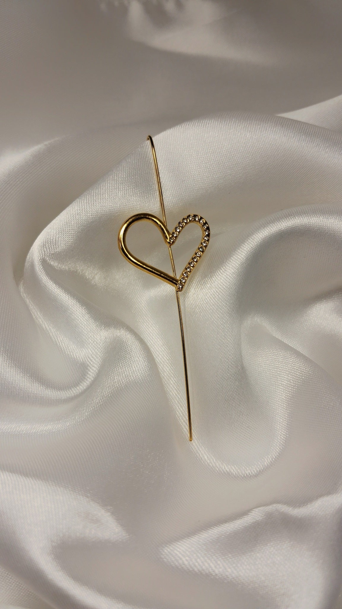 Gold-tone ear pin cuff with crystal-lined open heart