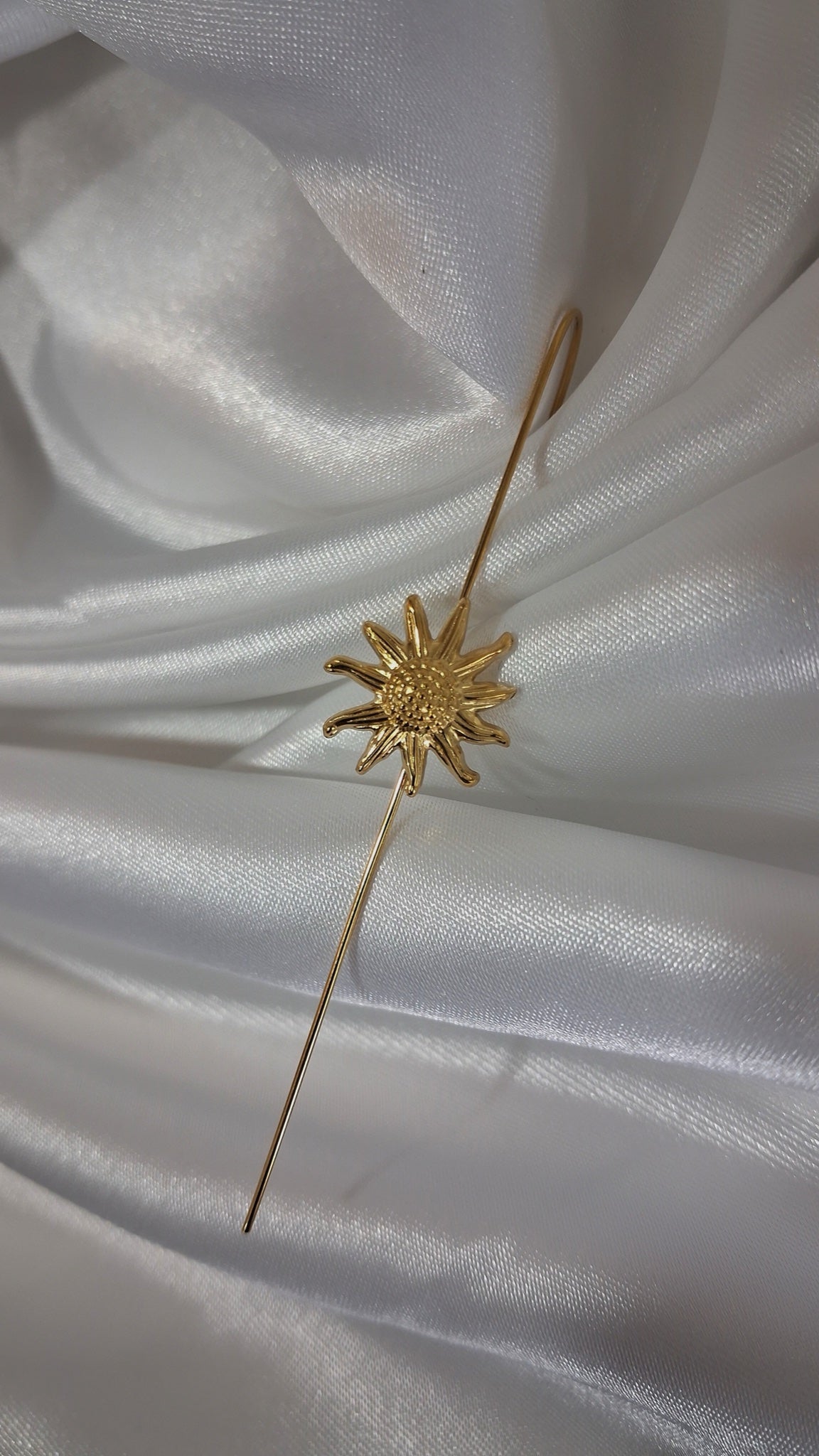 Gold-tone ear pin cuff with textured sunburst motif