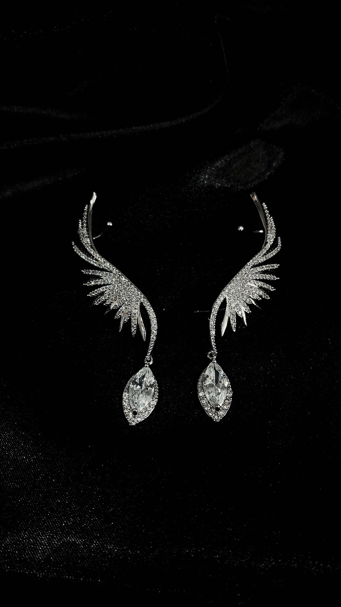 Pair of silver-tone crystal angel wing ear cuffs with marquise drops