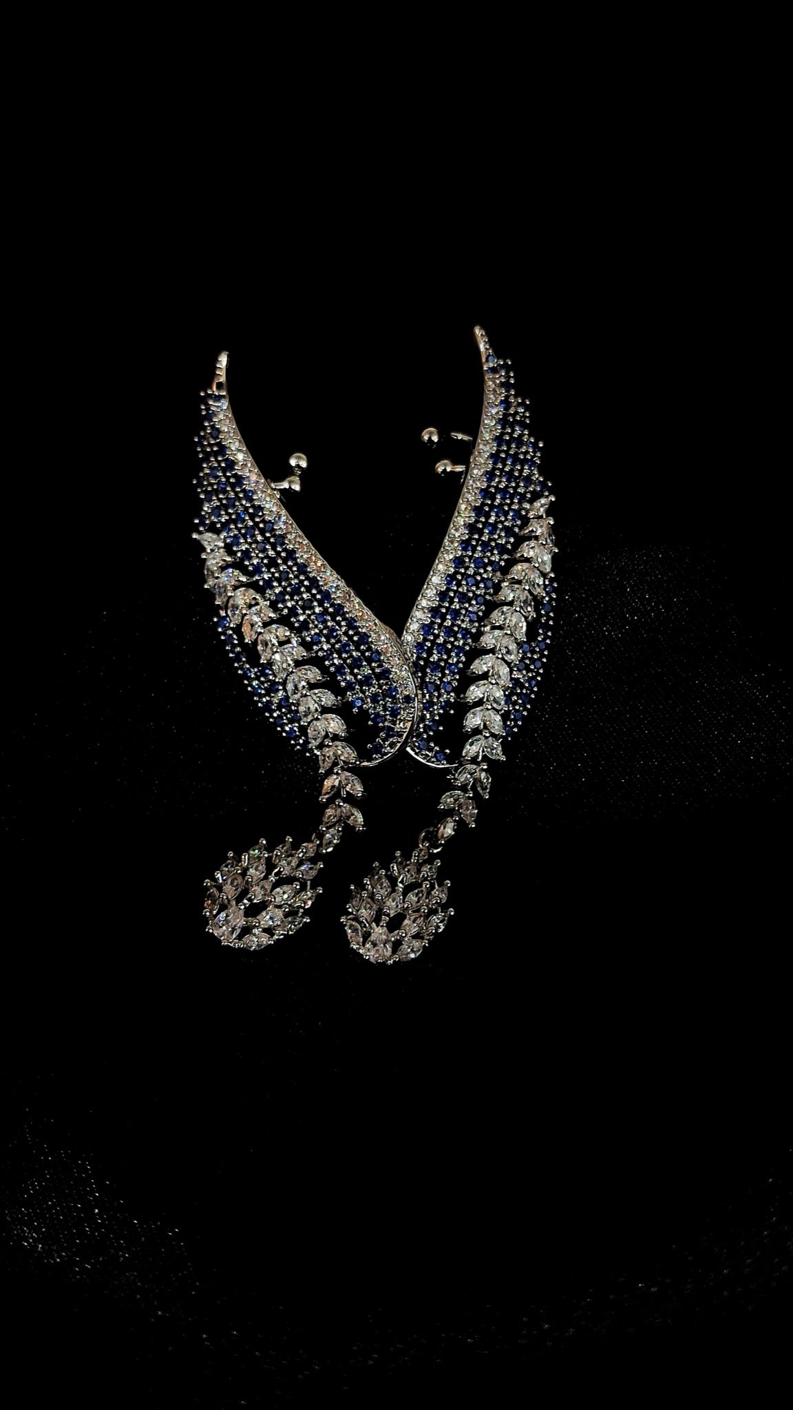 Pair of silver-tone leaf ear cuffs with sapphire-blue stones and crystal drops