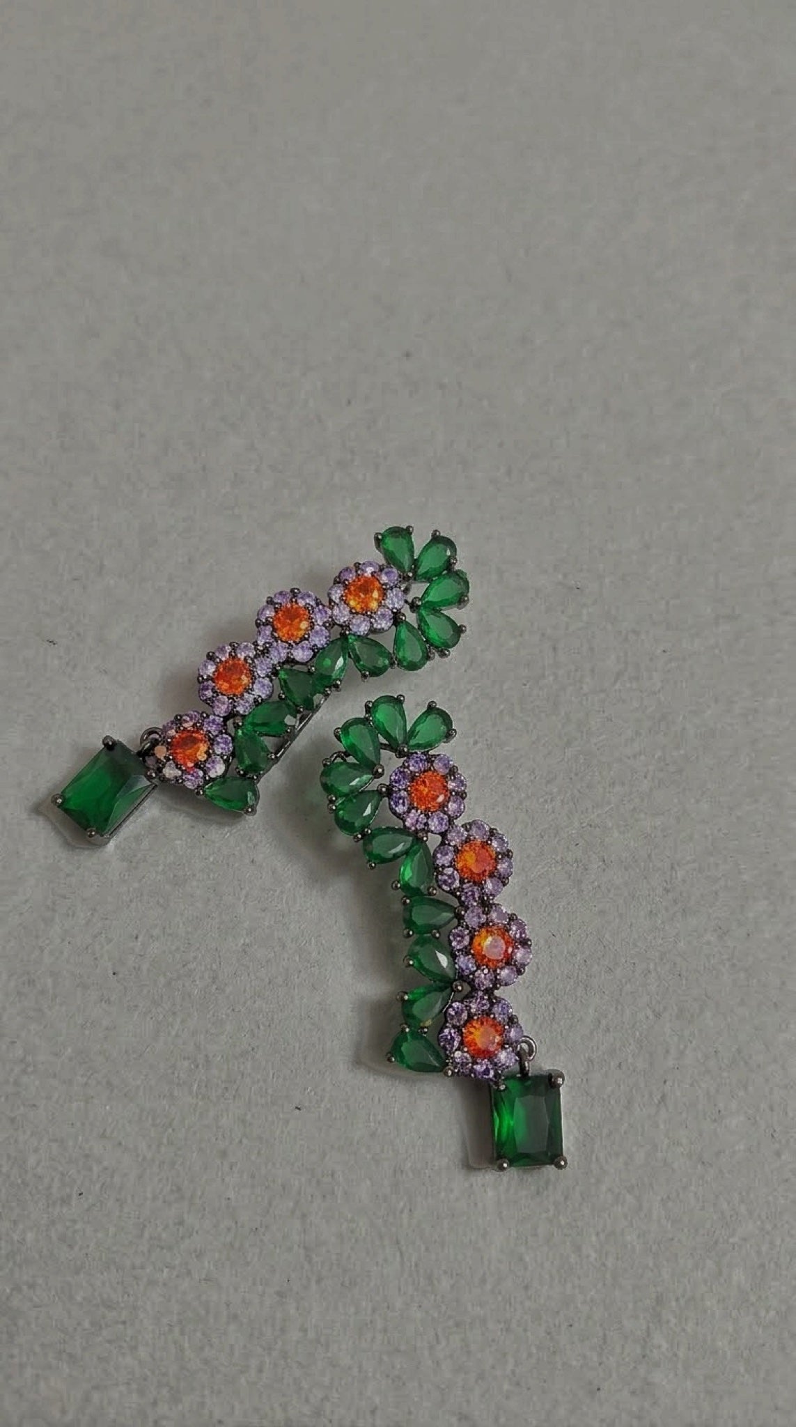 Gunmetal-tone floral ear climbers with green, orange and lavender stones - view 3