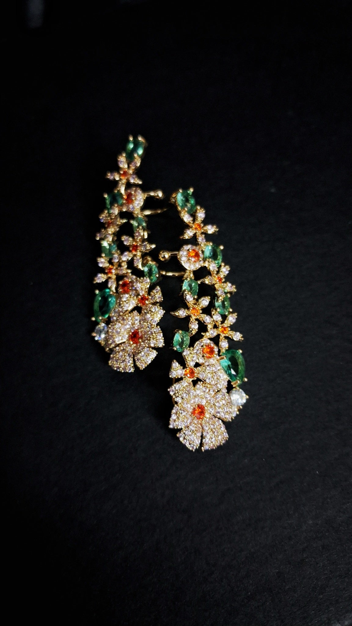 Gold-tone crystal flower ear climbers with green and orange stones