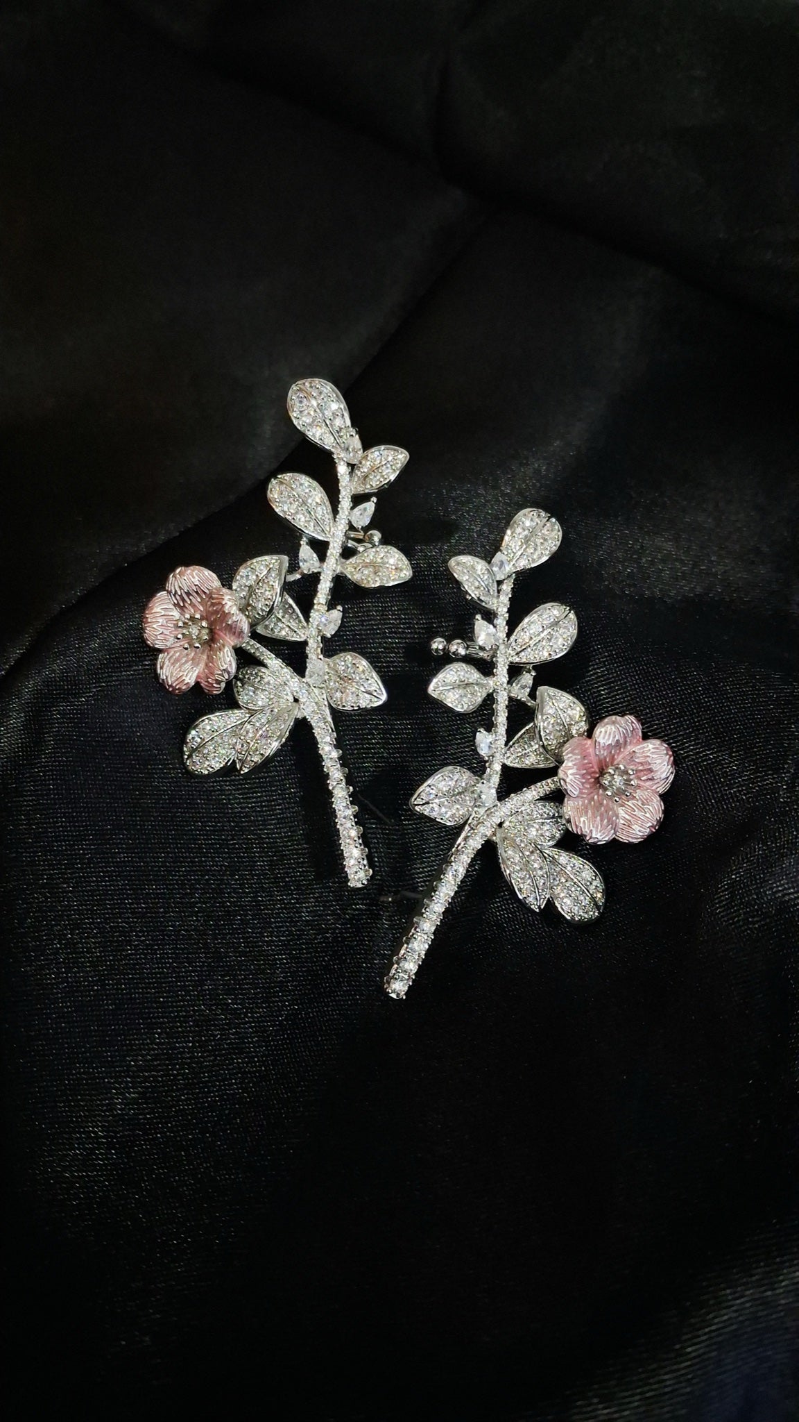 Silver-tone crystal branch ear climbers with pink enamel flower
