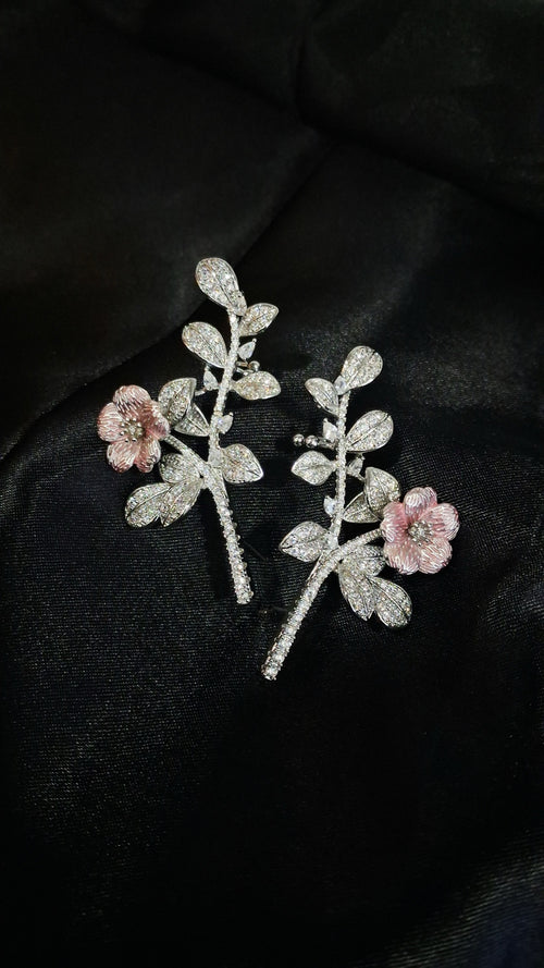Silver-tone crystal branch ear climbers with pink enamel flower