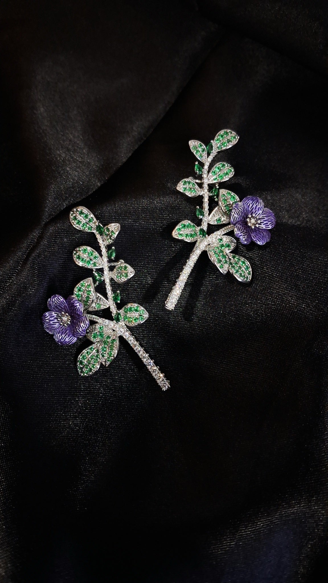 Silver-tone ear climbers with green stone leaves and purple enamel flower