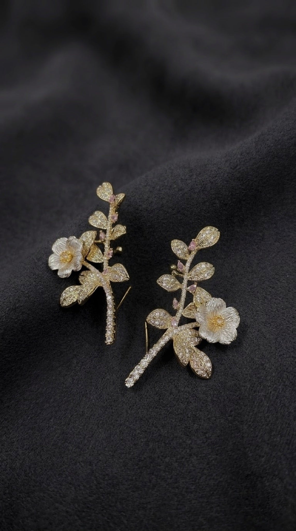 Gold-tone leafy ear climbers with white flower and pink accents