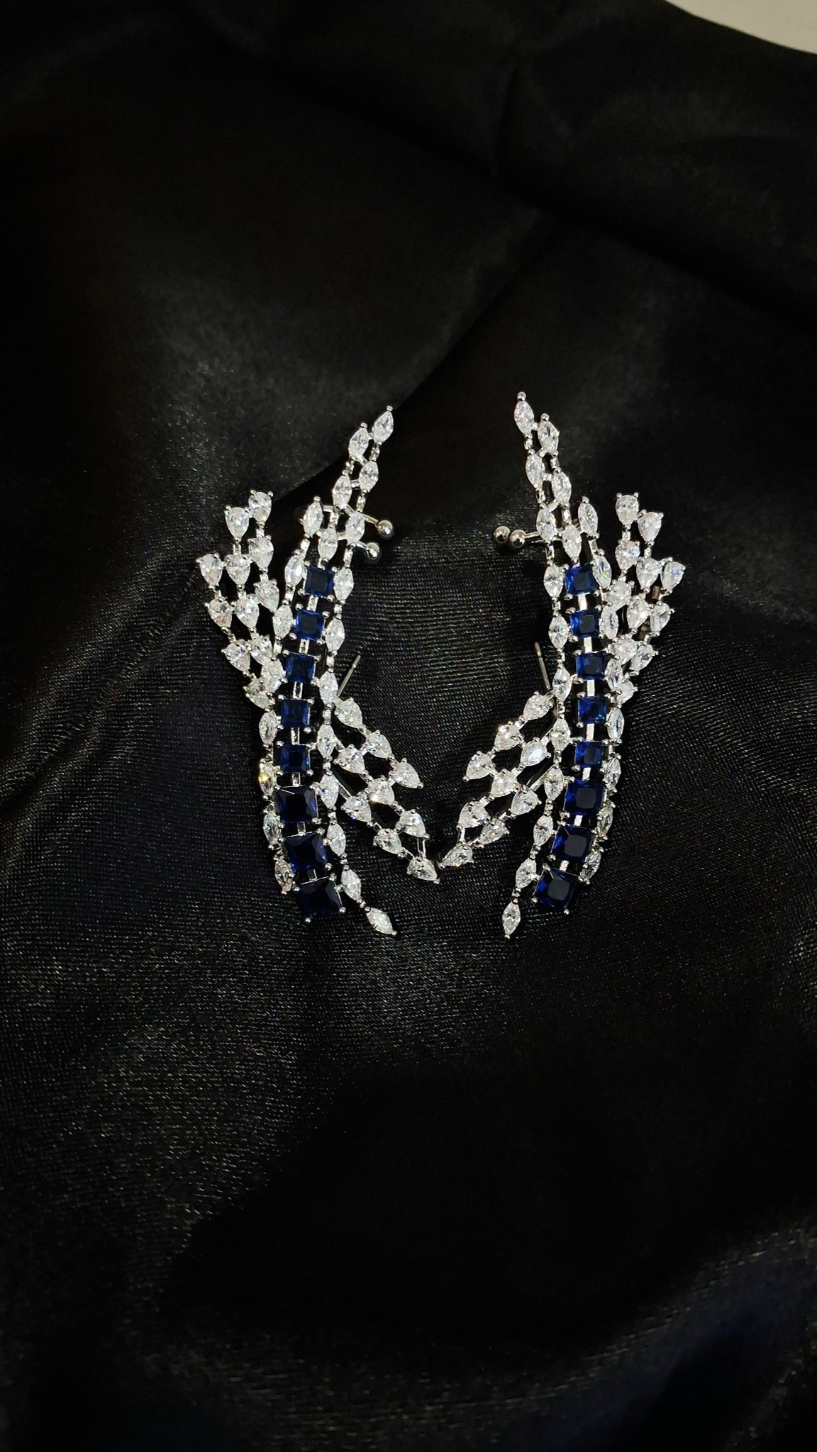 Silver-tone crystal spray ear climbers with blue square stones