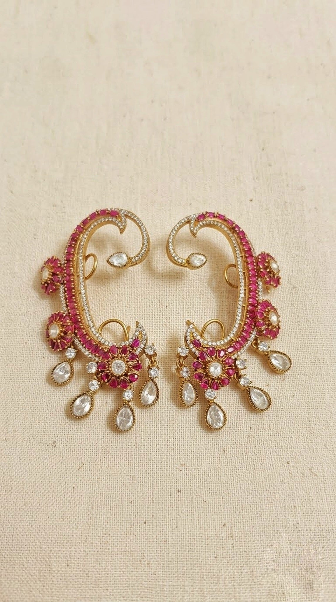 Gold-tone full-ear cuffs with pink stones, kundan-look florets and clear drops