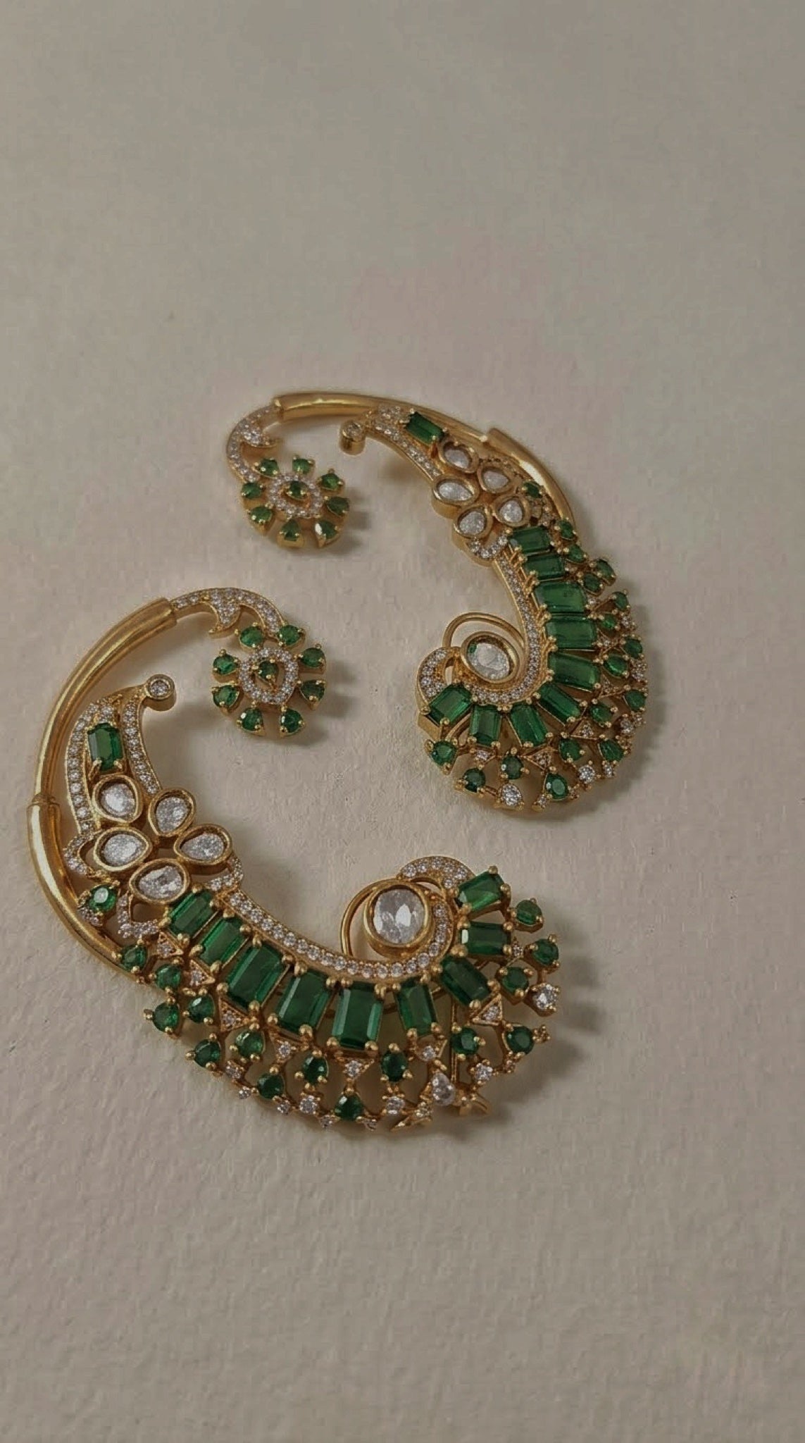 Gold-tone full-ear cuffs with green baguette stones and kundan-look petals - view 3