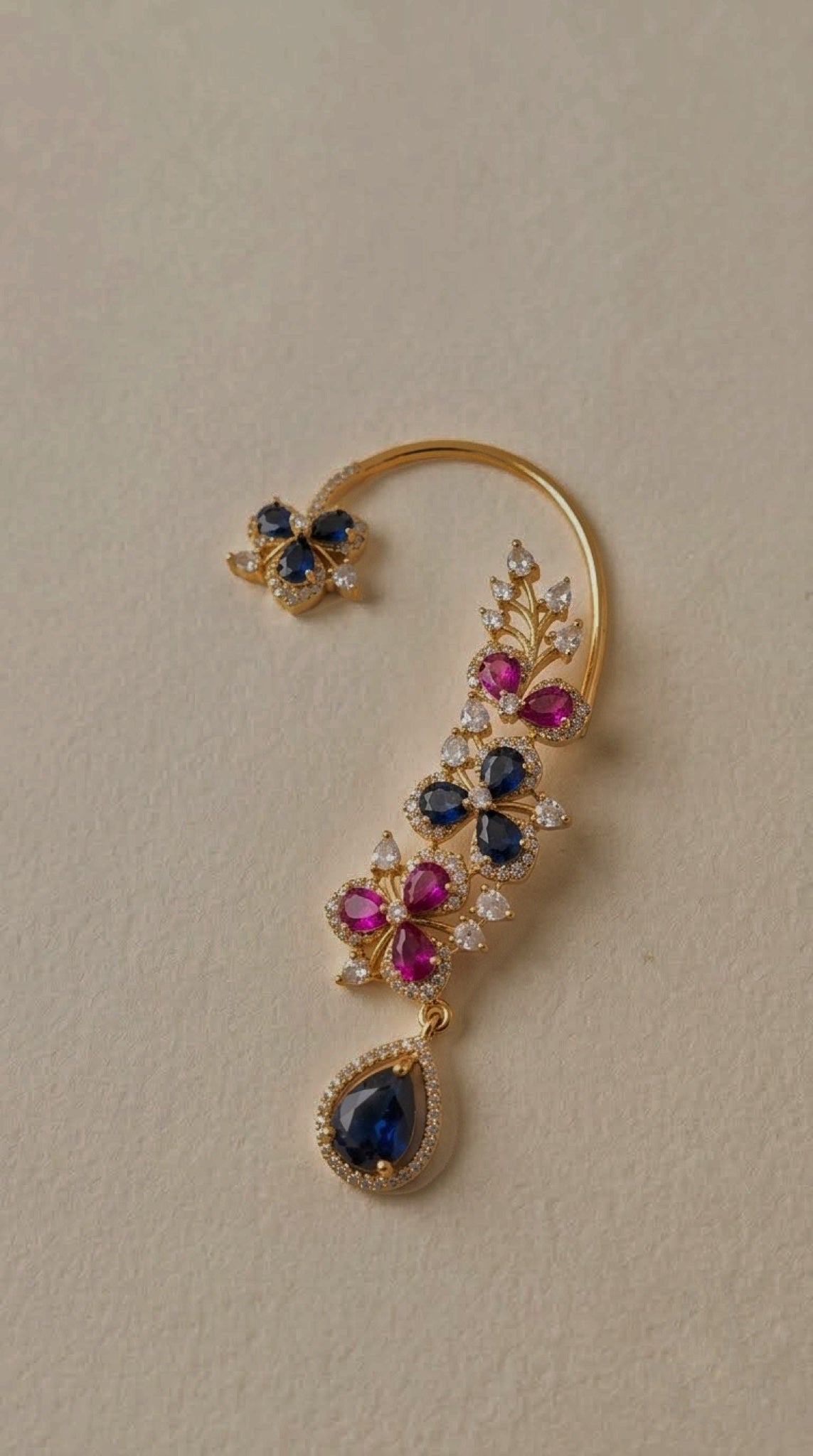 Gold-tone wire ear cuffs with pink and blue floral stones and blue teardrop drop - view 2
