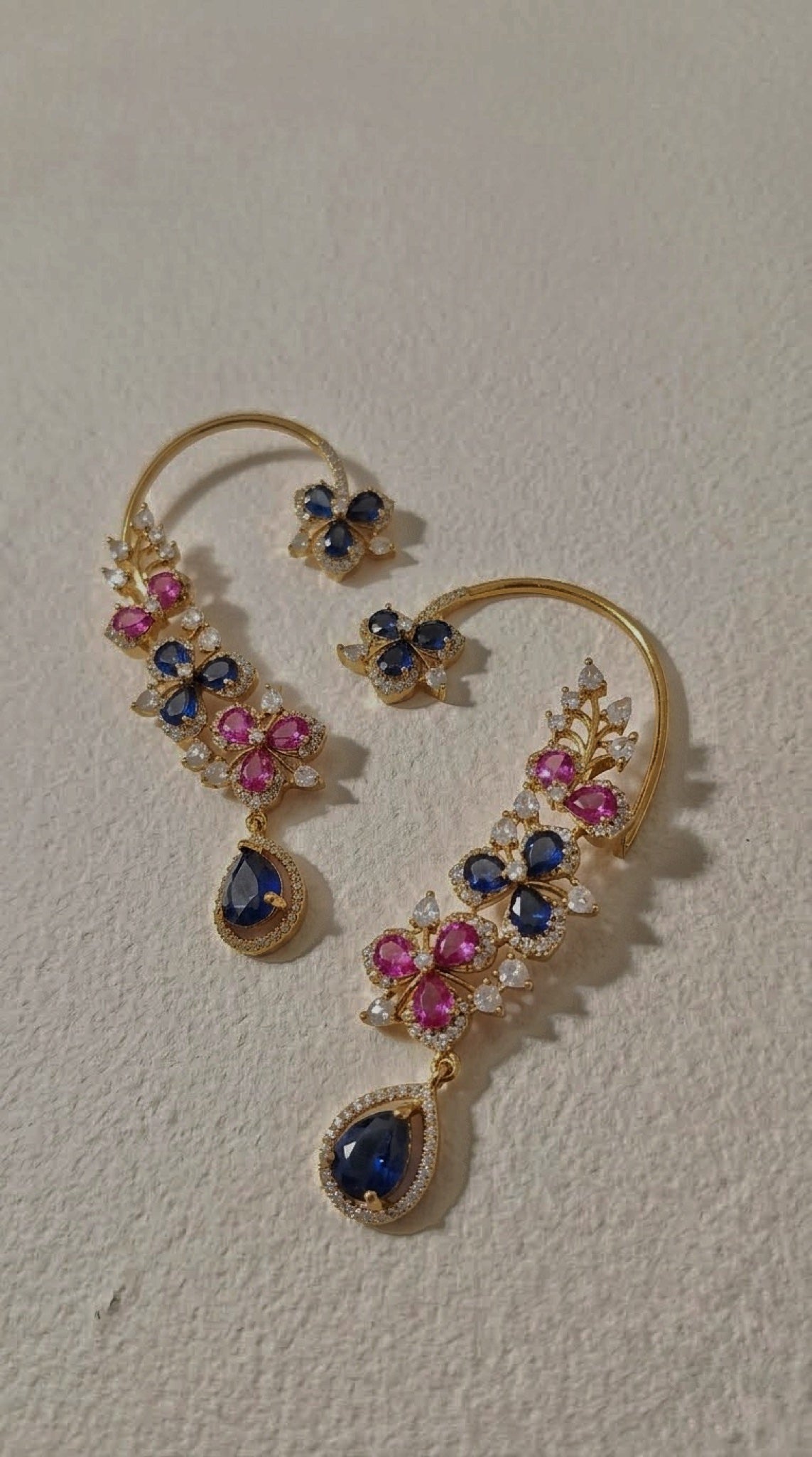 Gold-tone wire ear cuffs with pink and blue floral stones and blue teardrop drop - view 3