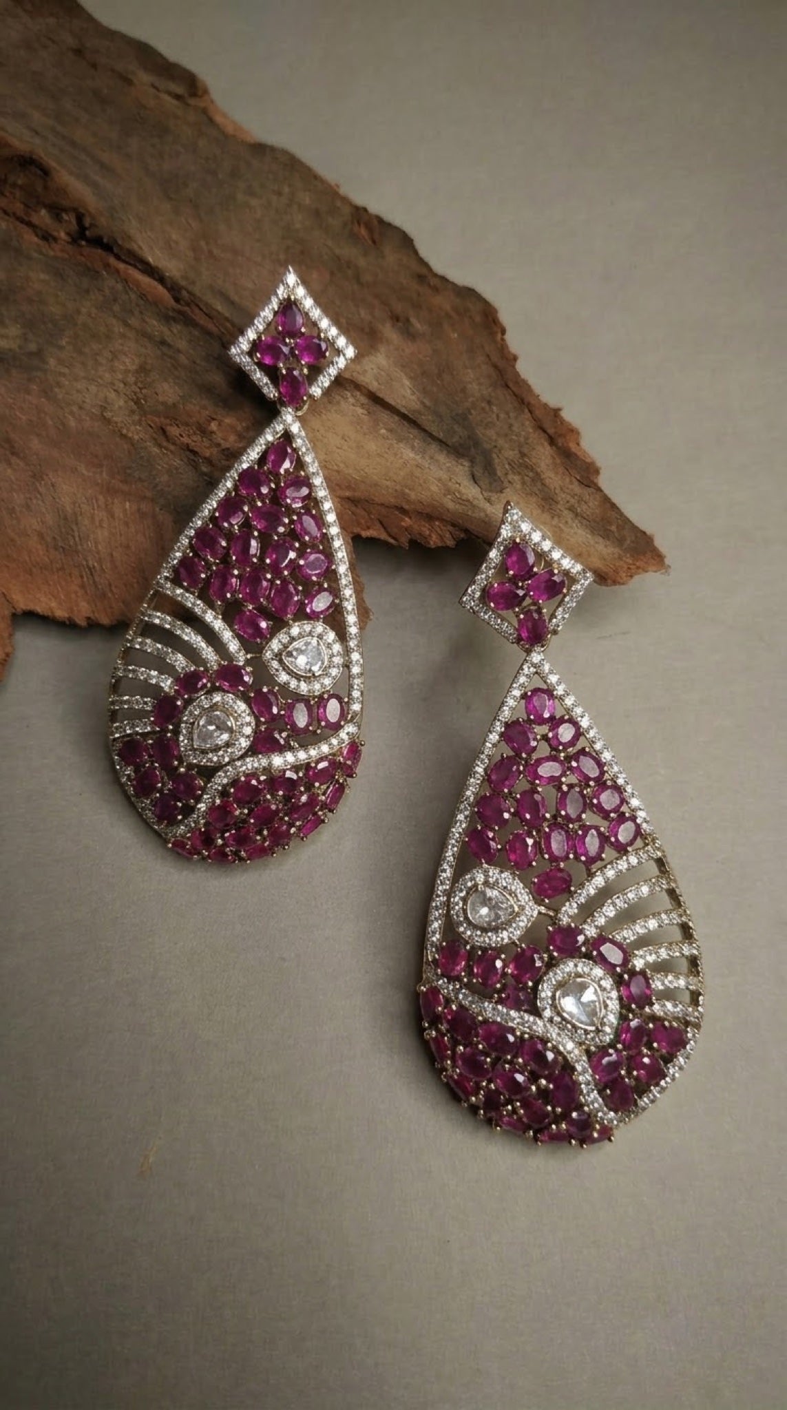 Teardrop earrings with ruby-pink stones and diamond-look crystal waves