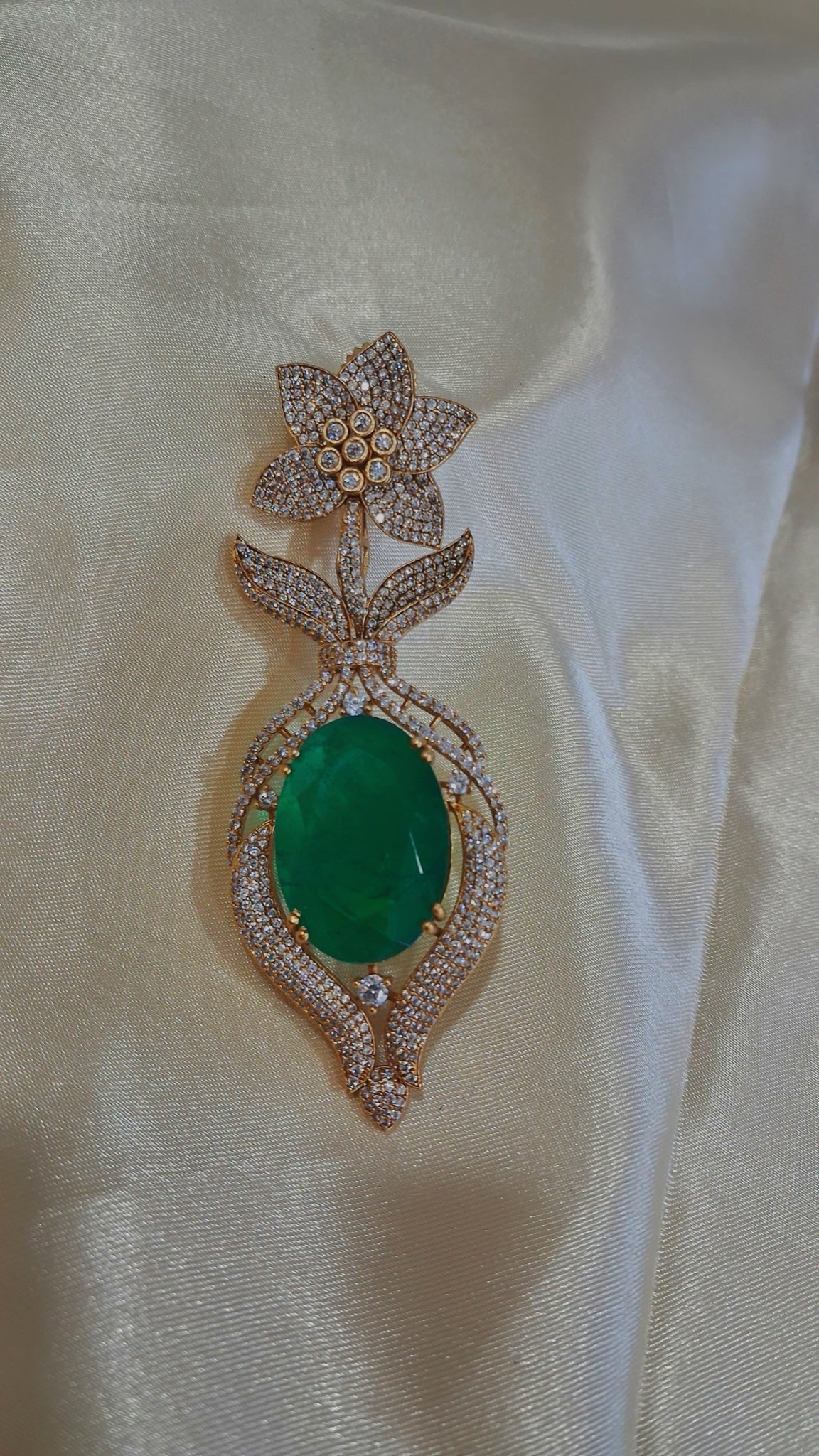Gold-tone drop earrings with oval green stone and crystal star-flower top - view 2