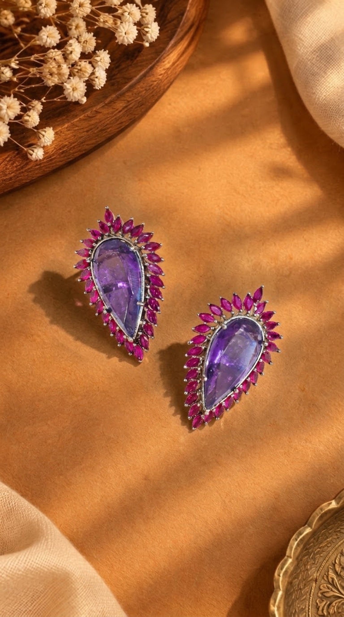 Pear-shaped stud earrings with lavender stone and fuchsia marquise halo