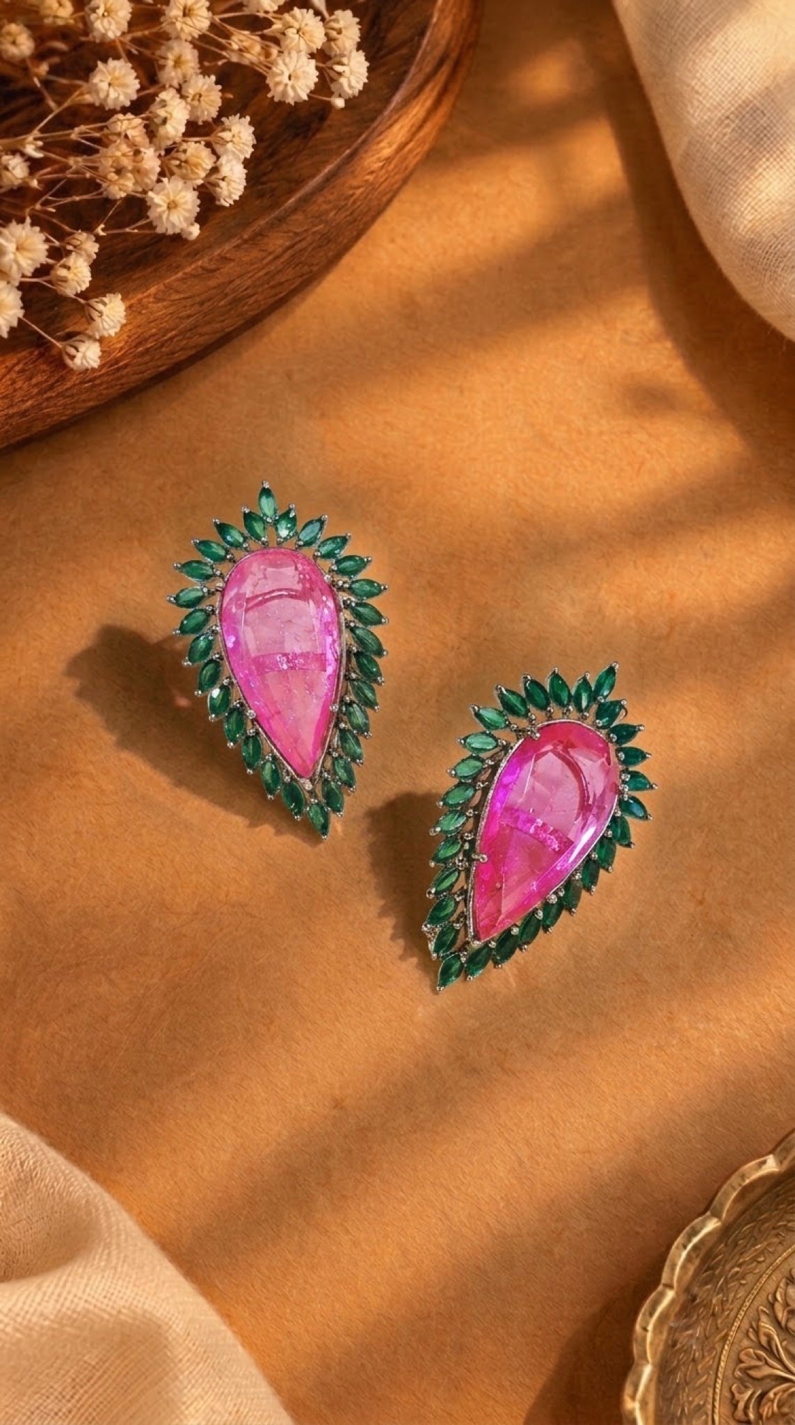 Pear-shaped stud earrings with pink stone and green marquise halo