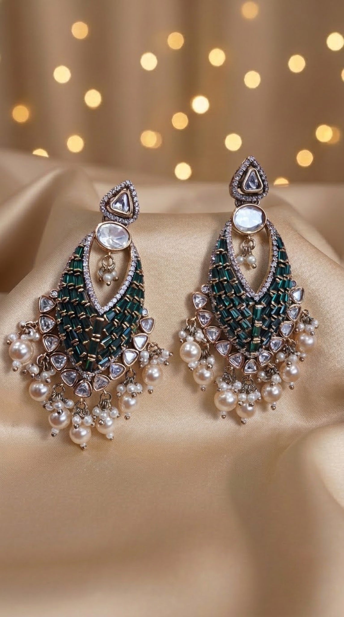 Kundan chandbali earrings with green baguette stones and faux pearl fringe