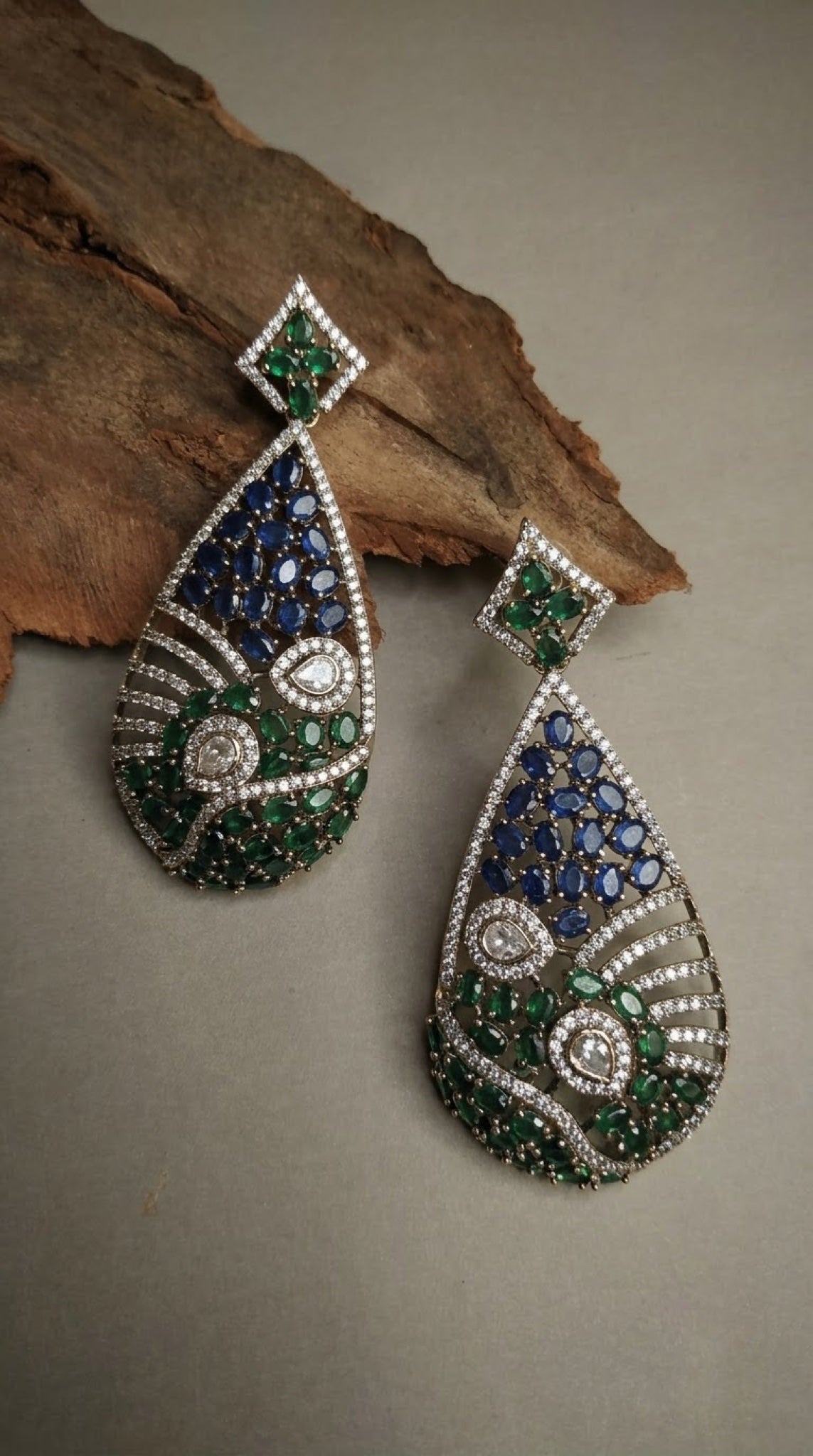 Teardrop earrings with blue and green stones and crystal waves