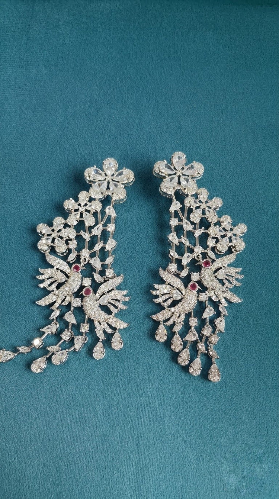 Silver-tone crystal earrings with lovebird motif and teardrop cascade