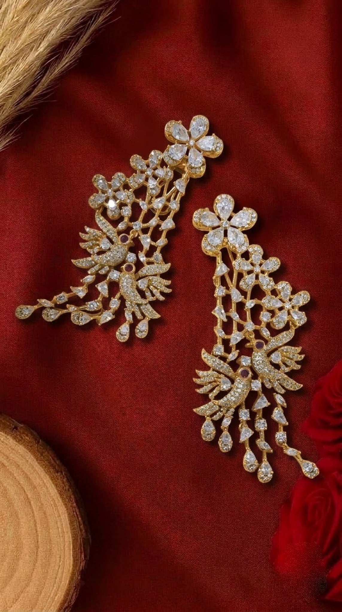 Gold-tone crystal earrings with lovebird motif and teardrop cascade