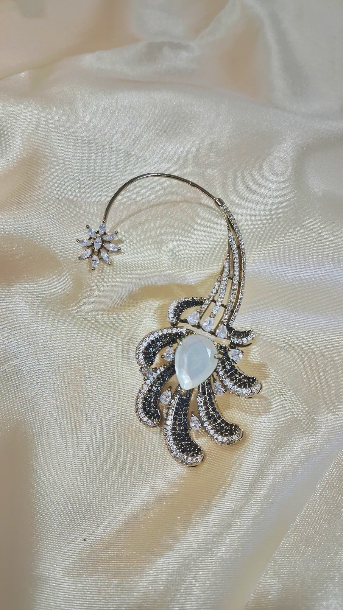 Silver-tone ear cuff earrings with black and clear stone plumes - view 2