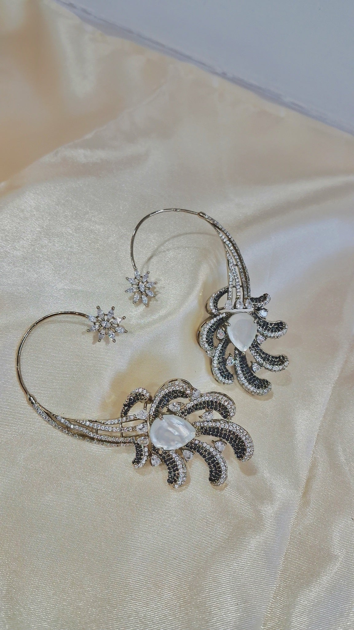 Silver-tone ear cuff earrings with black and clear stone plumes - view 3