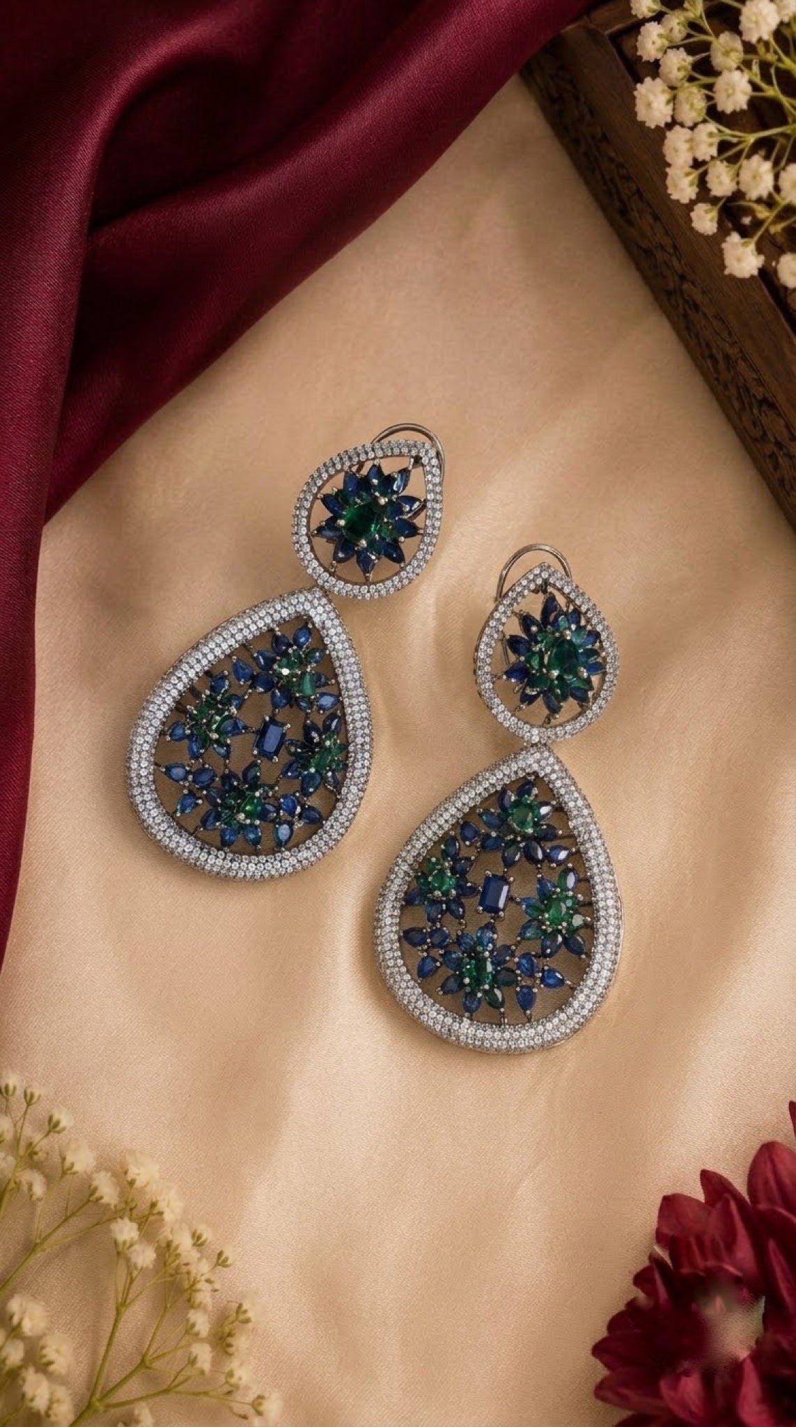 Silver-tone teardrop earrings with blue and green floral stones