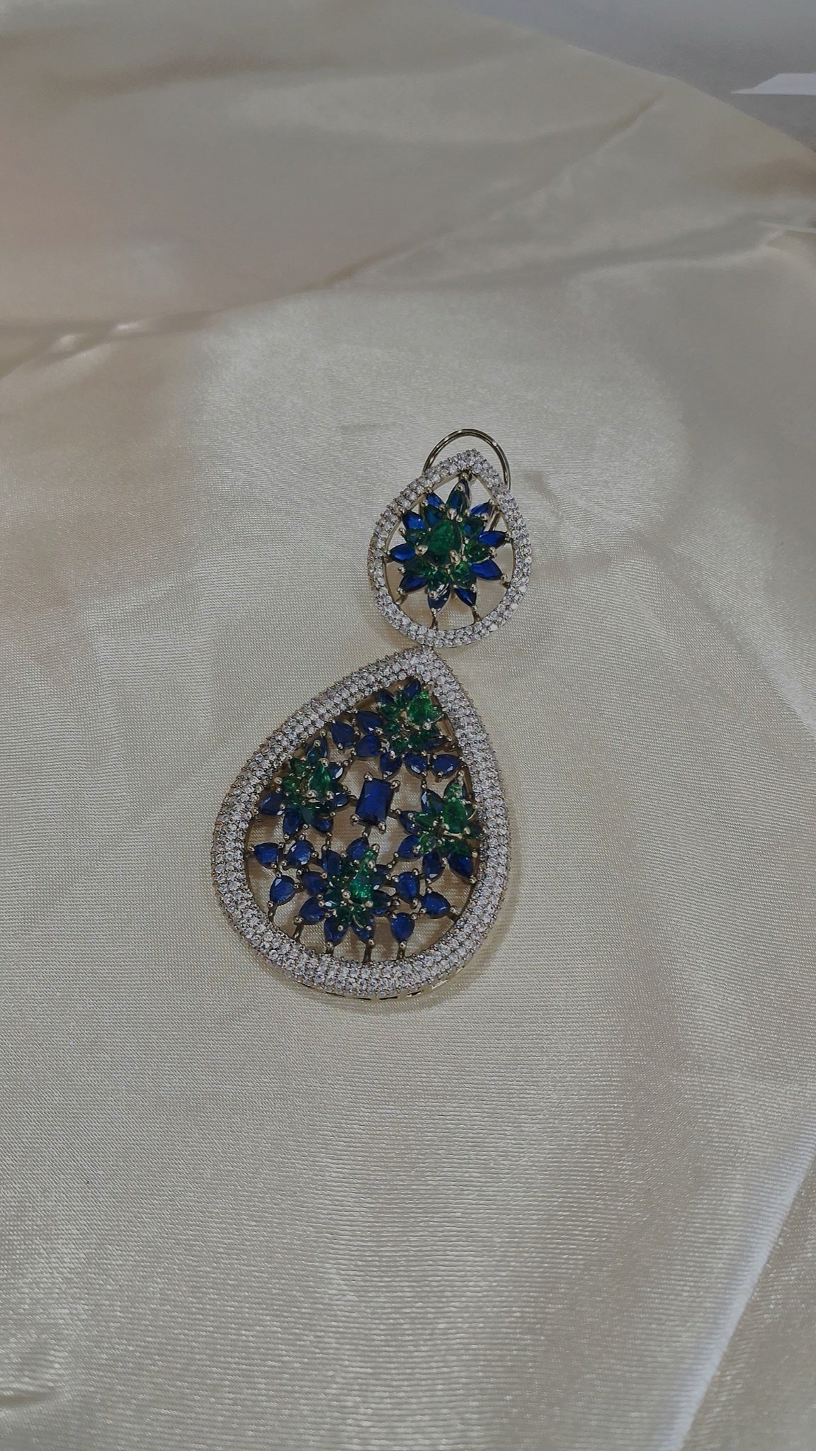 Silver-tone teardrop earrings with blue and green floral stones - view 2