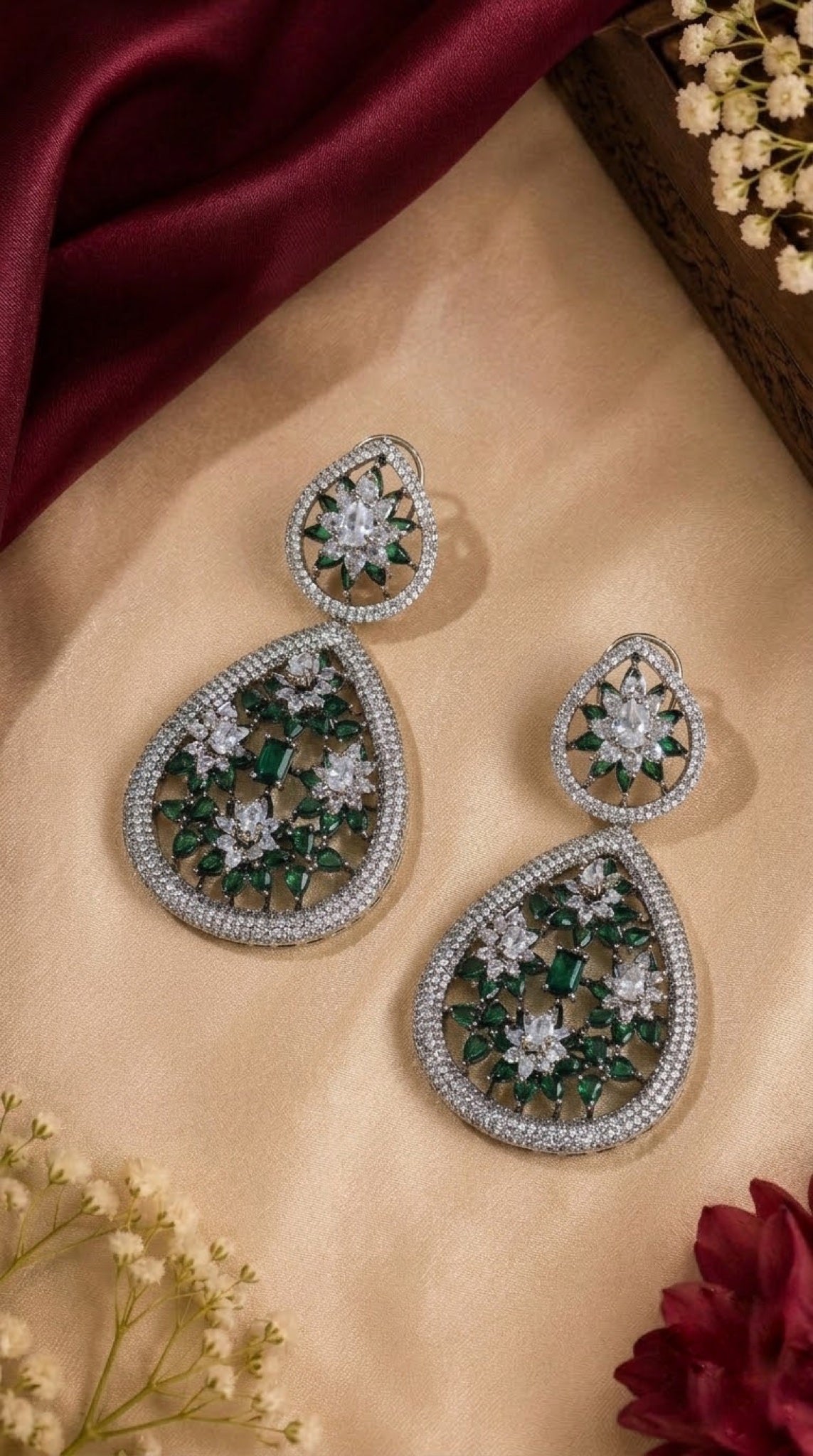 Silver-tone double teardrop earrings with green and crystal floral stones