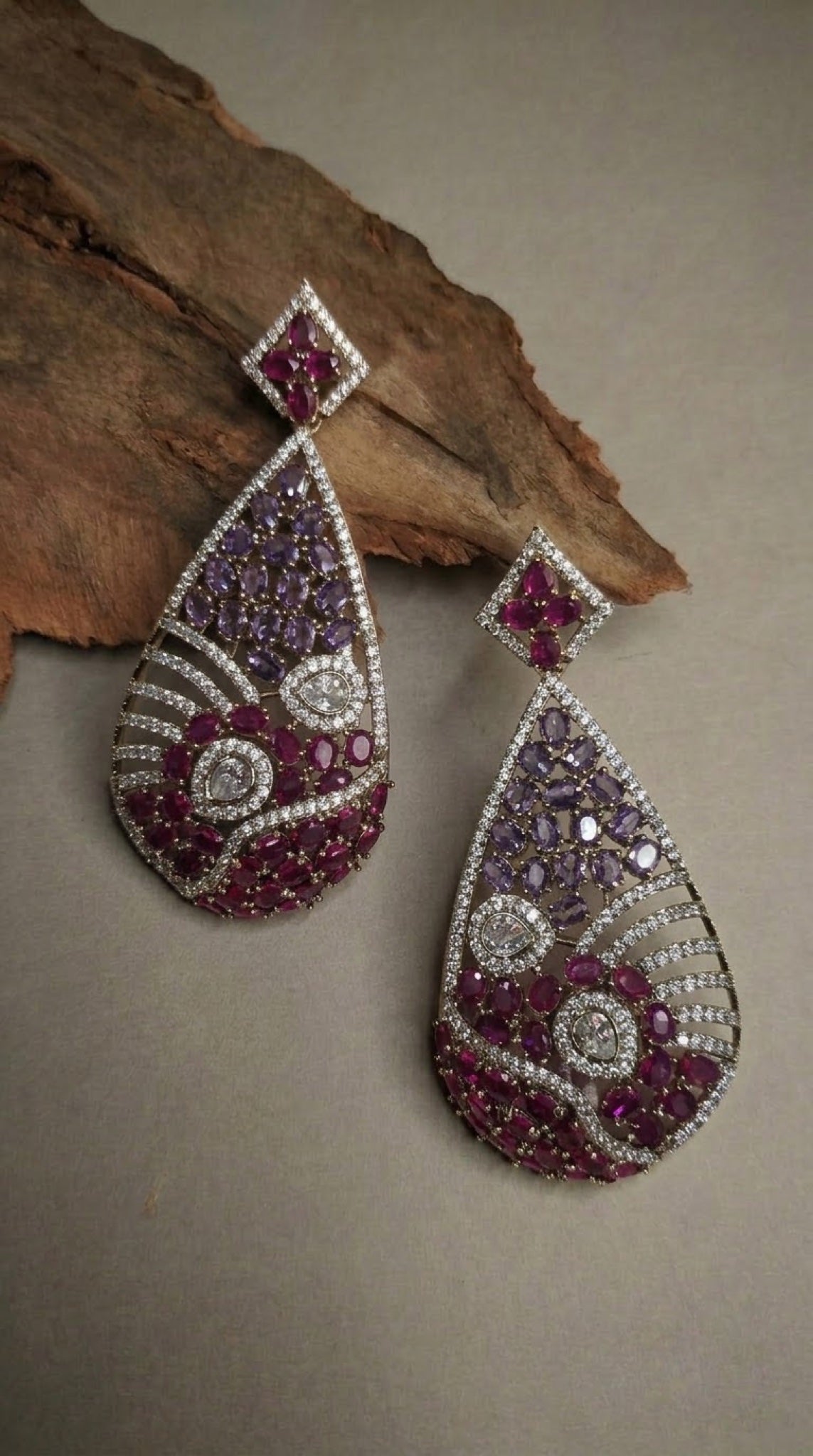 Teardrop earrings with lilac and ruby-pink stones and crystal waves