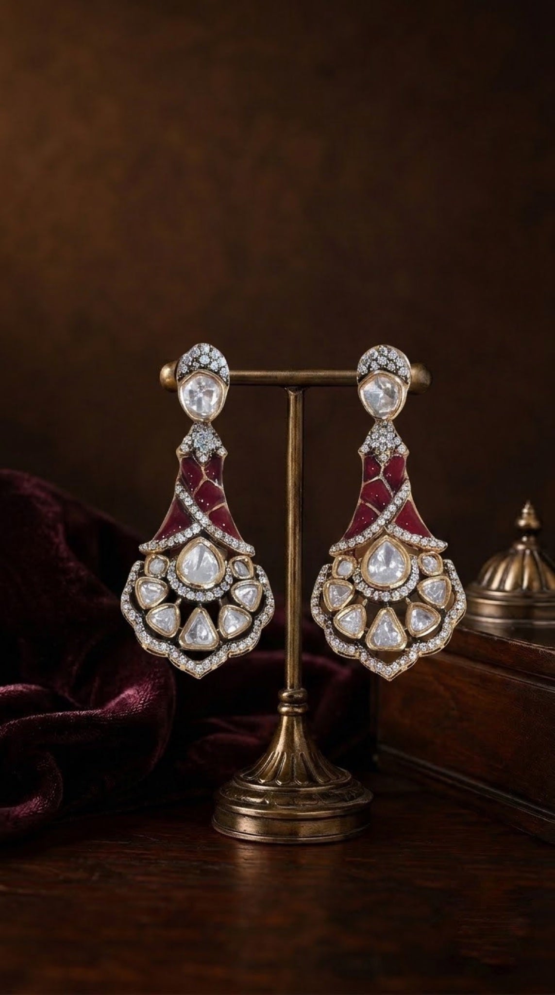 Gold-tone kundan drop earrings with ruby-red stones and scalloped fan