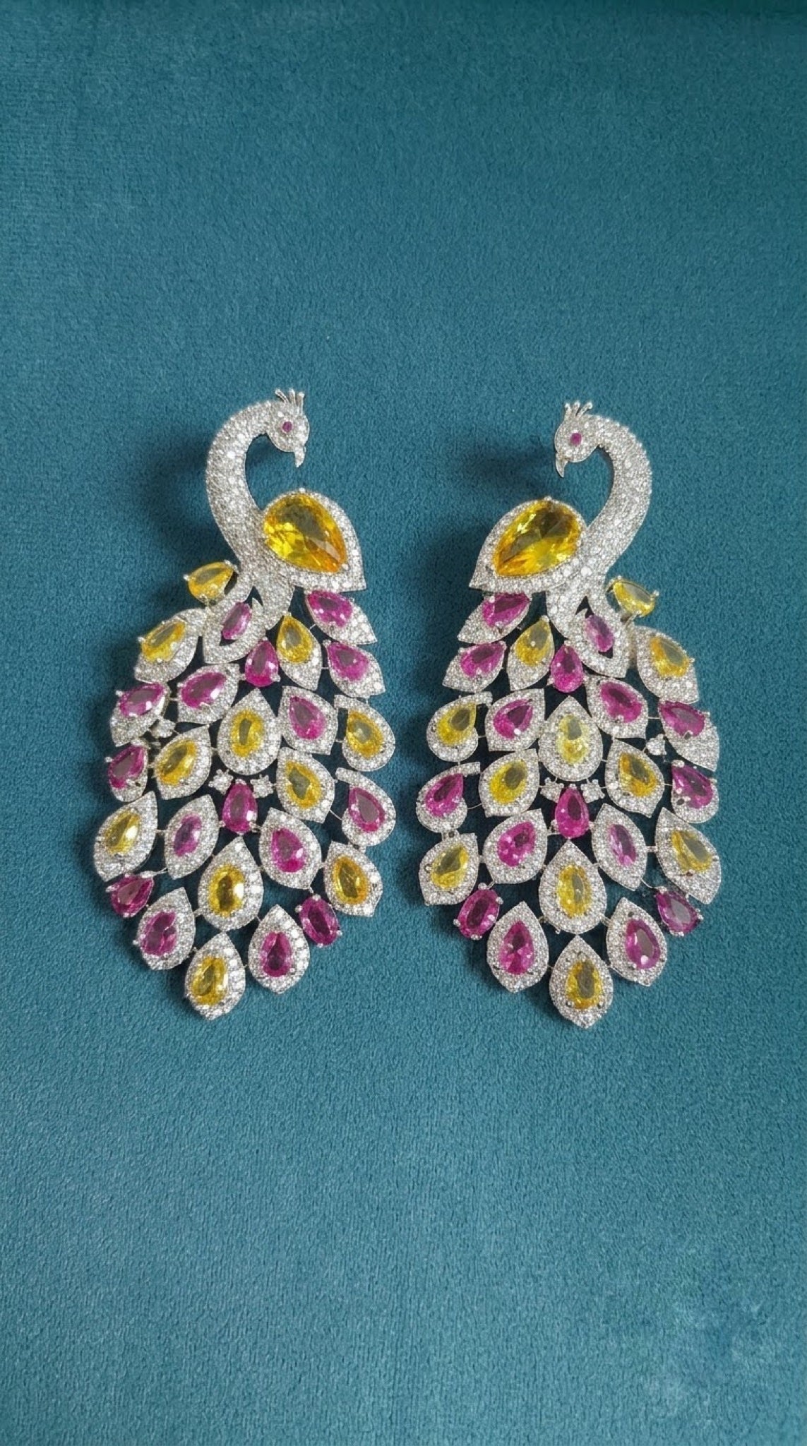 Silver-tone peacock earrings with yellow and pink pear crystals
