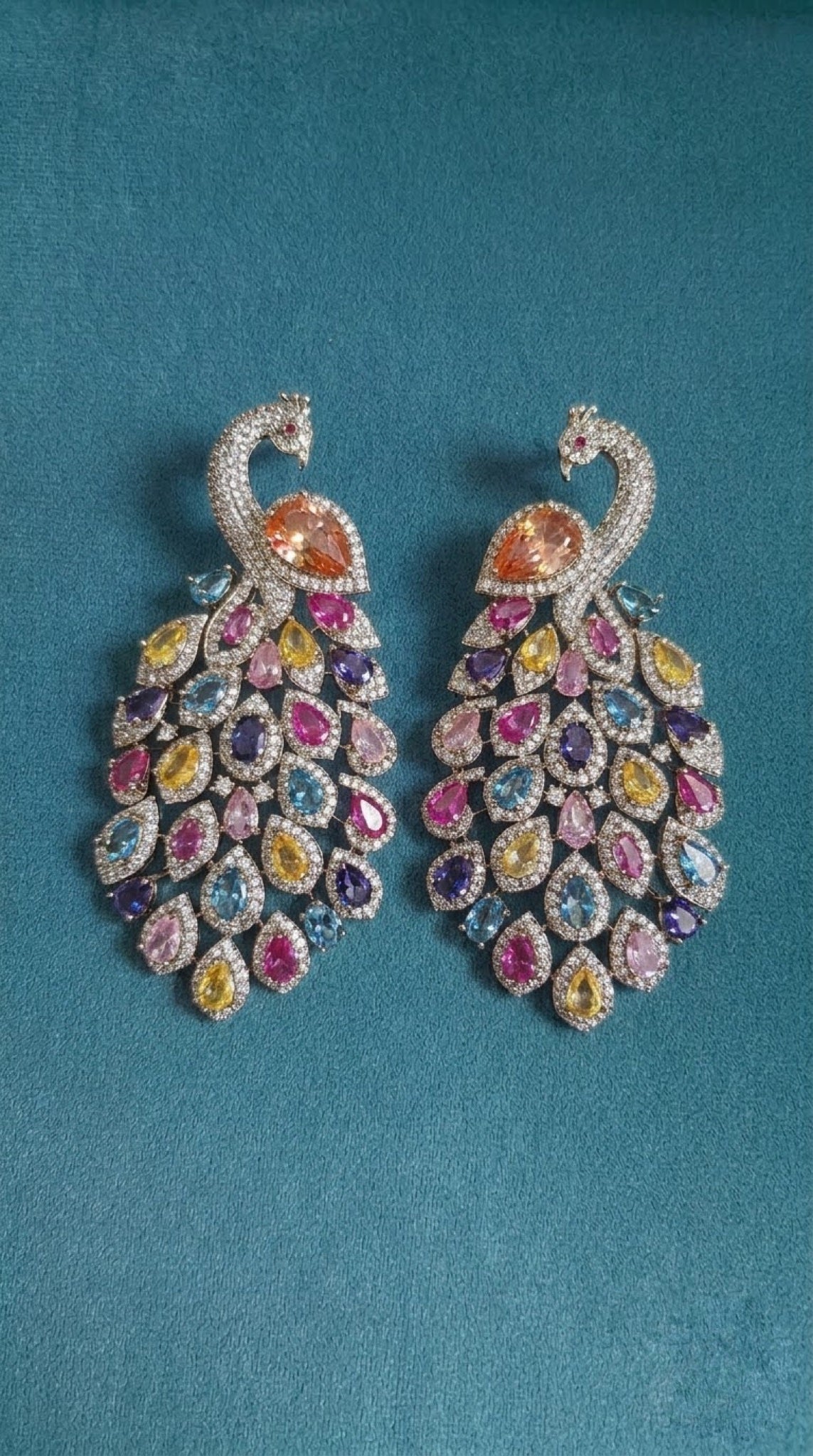 Silver-tone peacock earrings with multicolour pastel crystals