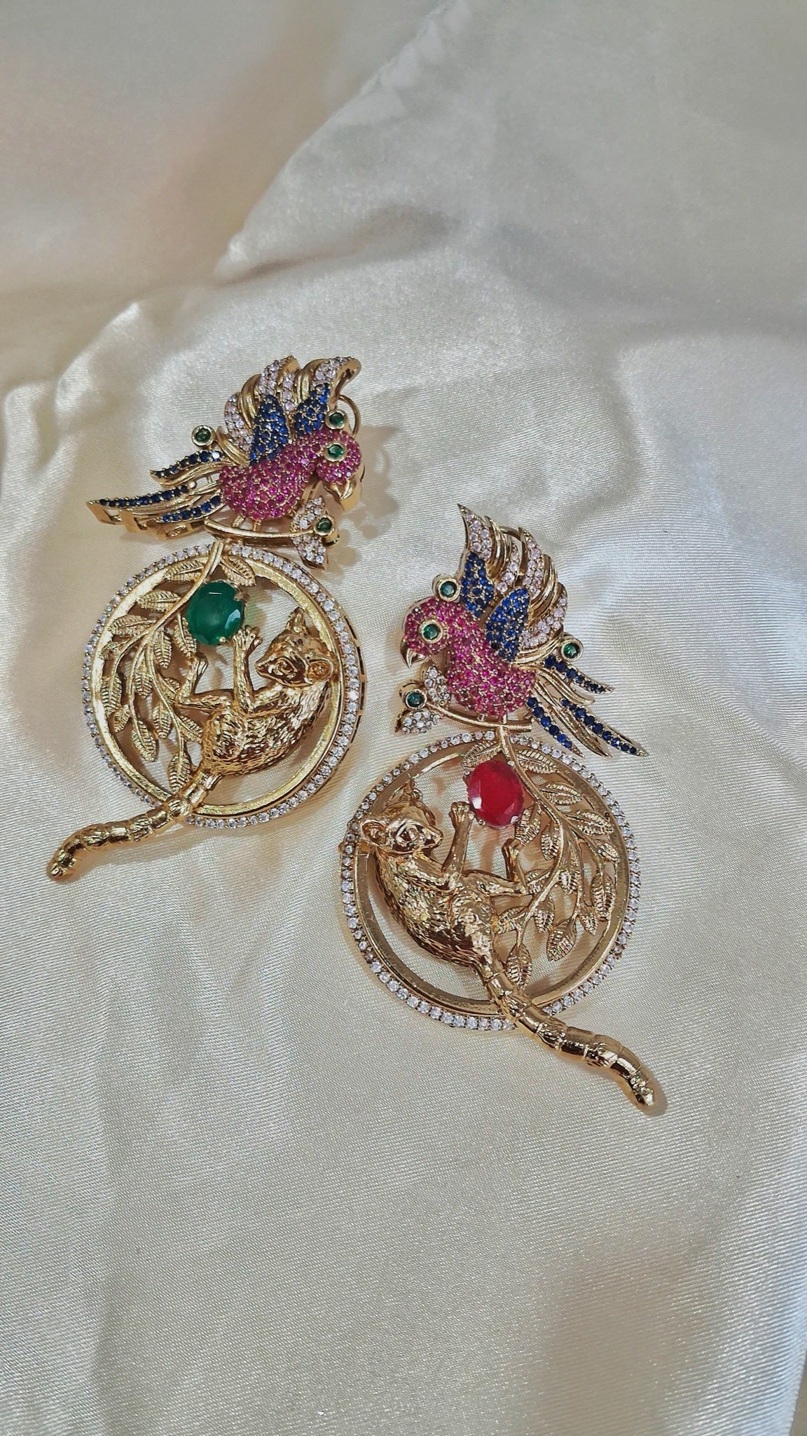 Gold-tone parrot and leopard medallion earrings with pink, blue, red and green crystals - view 3
