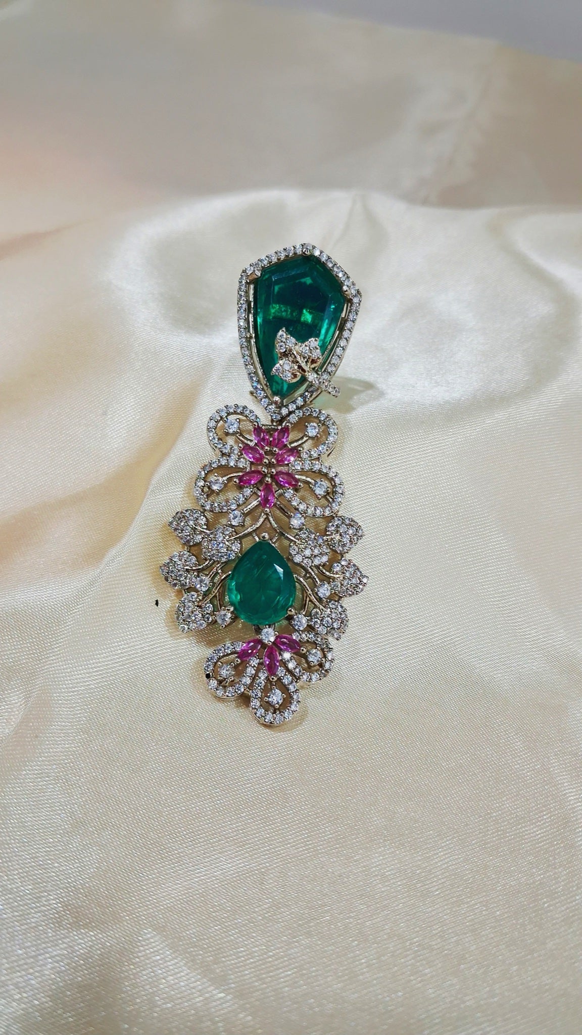 Gold-tone filigree earrings with emerald-green stones and pink crystals - view 2