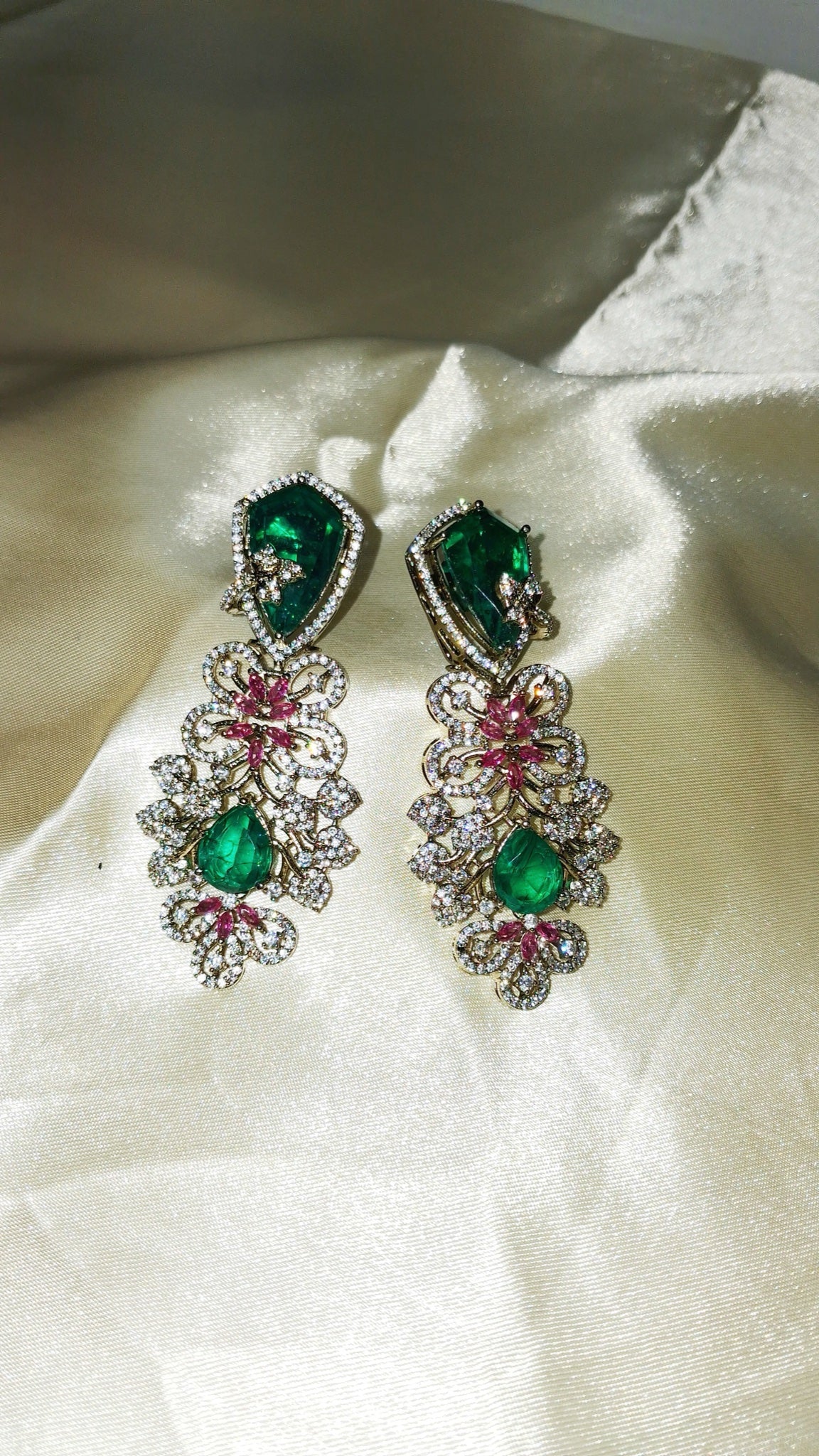 Gold-tone filigree earrings with emerald-green stones and pink crystals - view 3