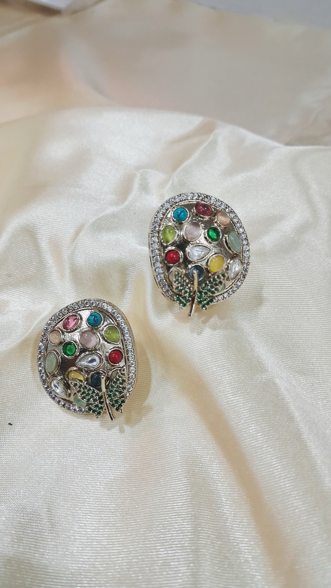Silver-tone oval stud earrings with multicolour stones and green pavé leaf - view 3
