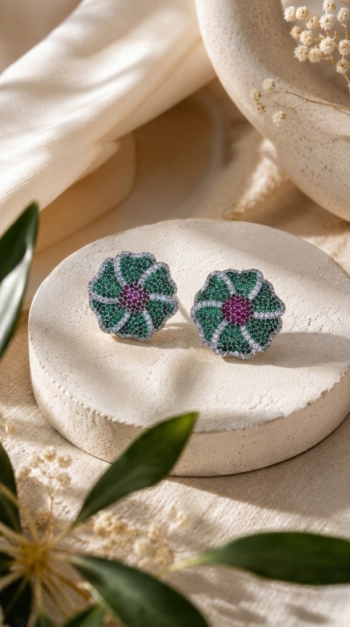 Green pavé flower stud earrings with pink centre